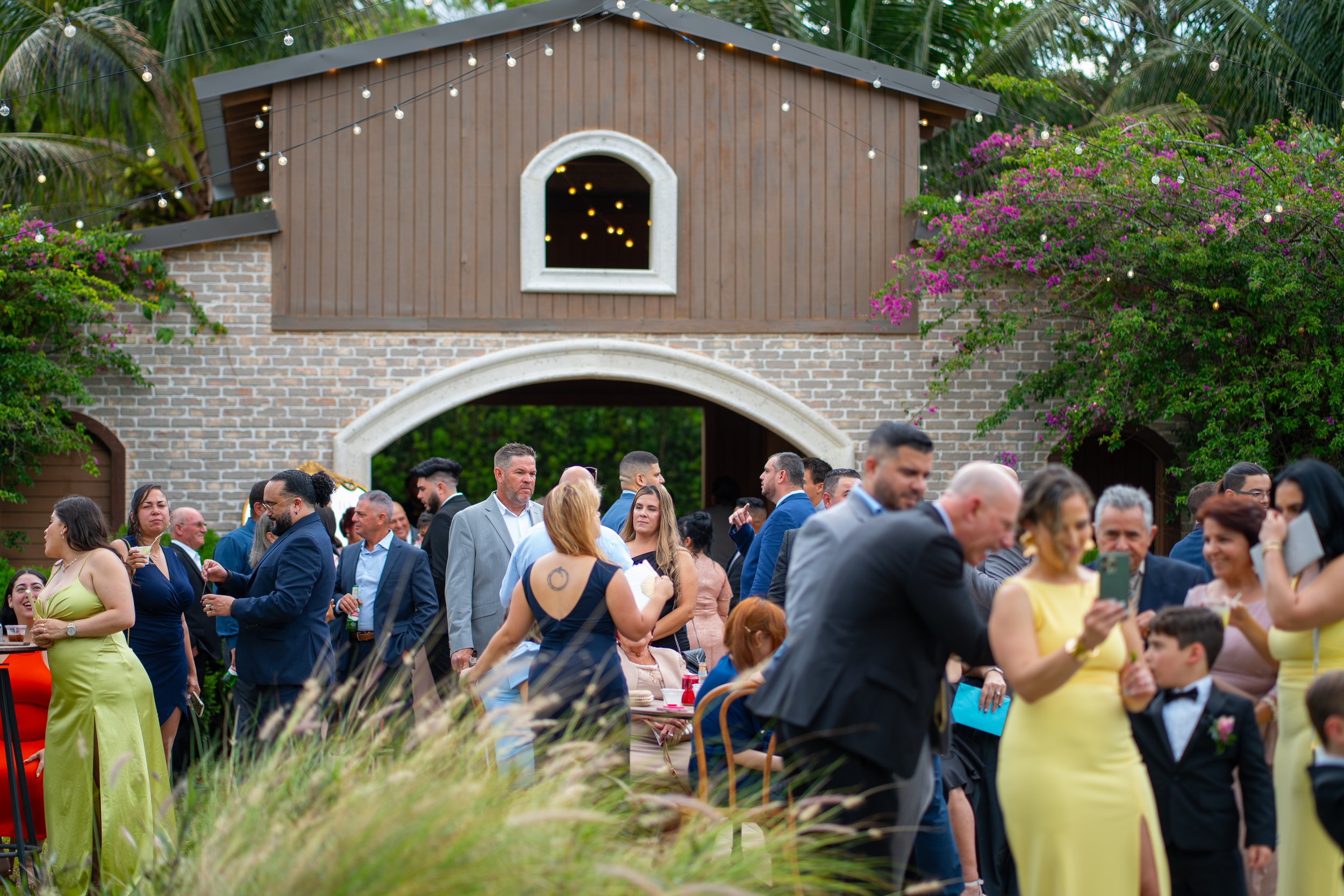 Outdoor wedding cocktail hour setup at Cinco Farm Gardens in Miami