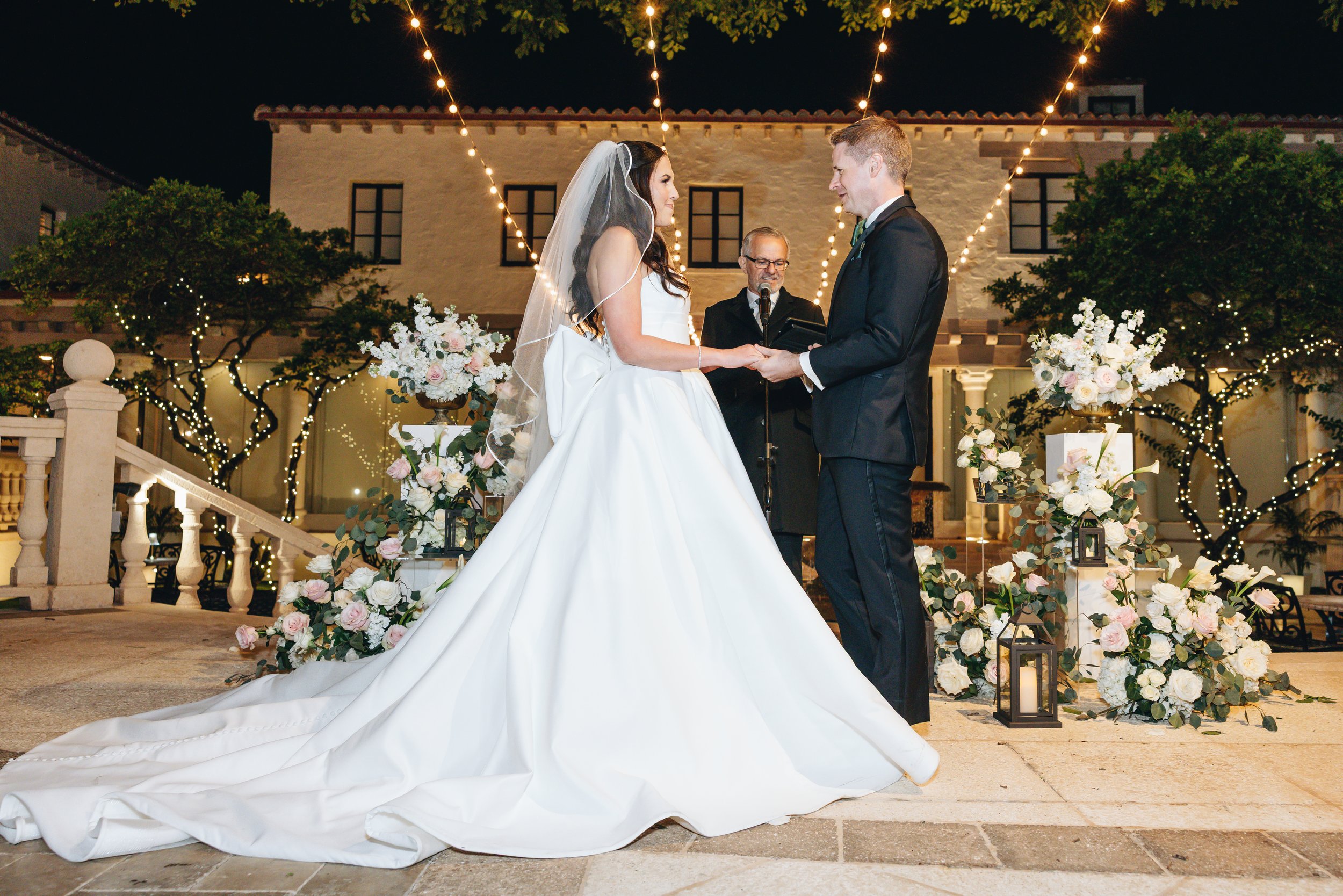 Bride and groom at the altar during outdoor wedding ceremony at The Addison Boca Raton