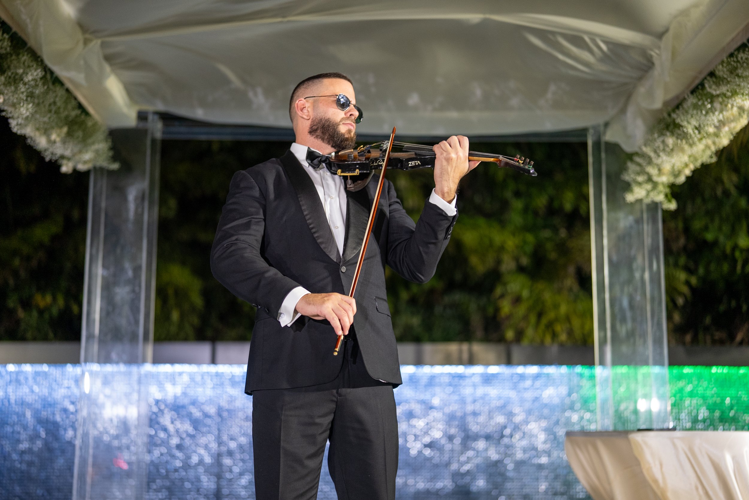 Live violin performance under the chuppah at The Glass Venue in Miami
