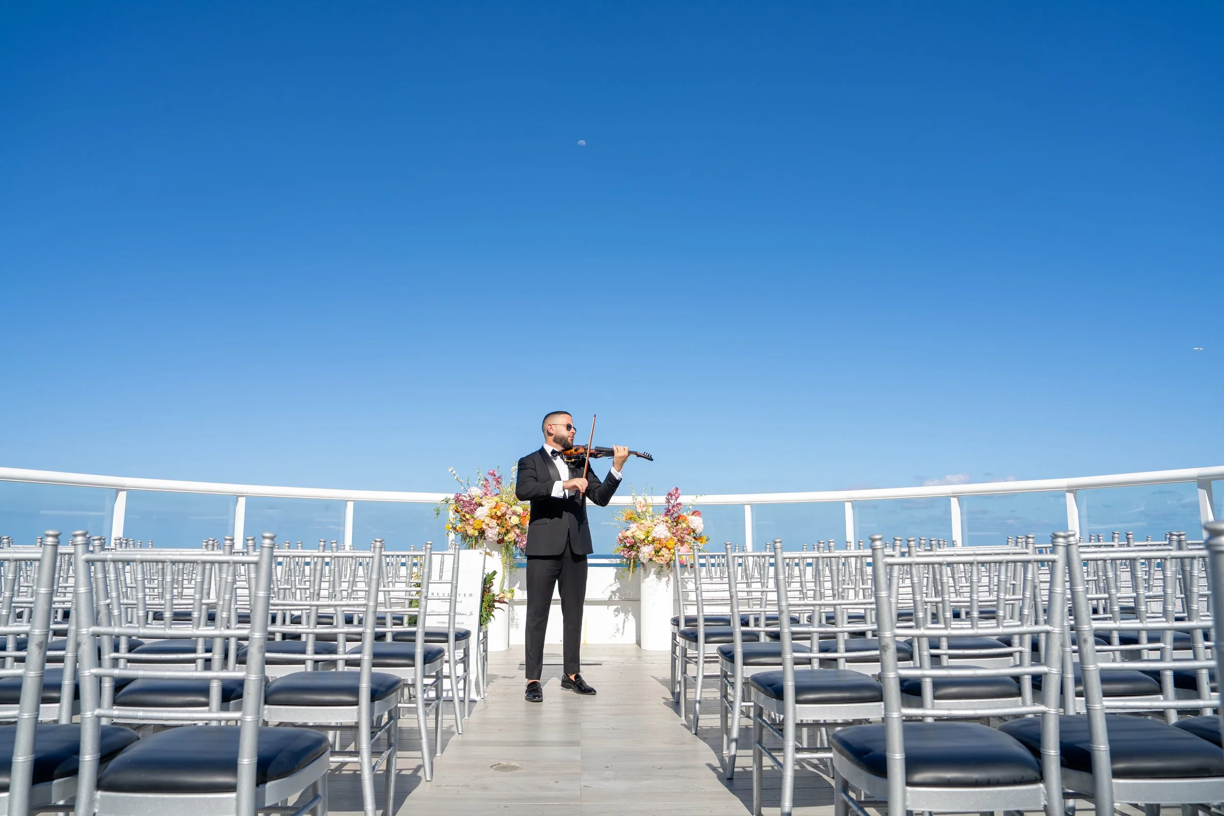 Live violin performance during rooftop wedding ceremony at Beach House Fort Lauderdale