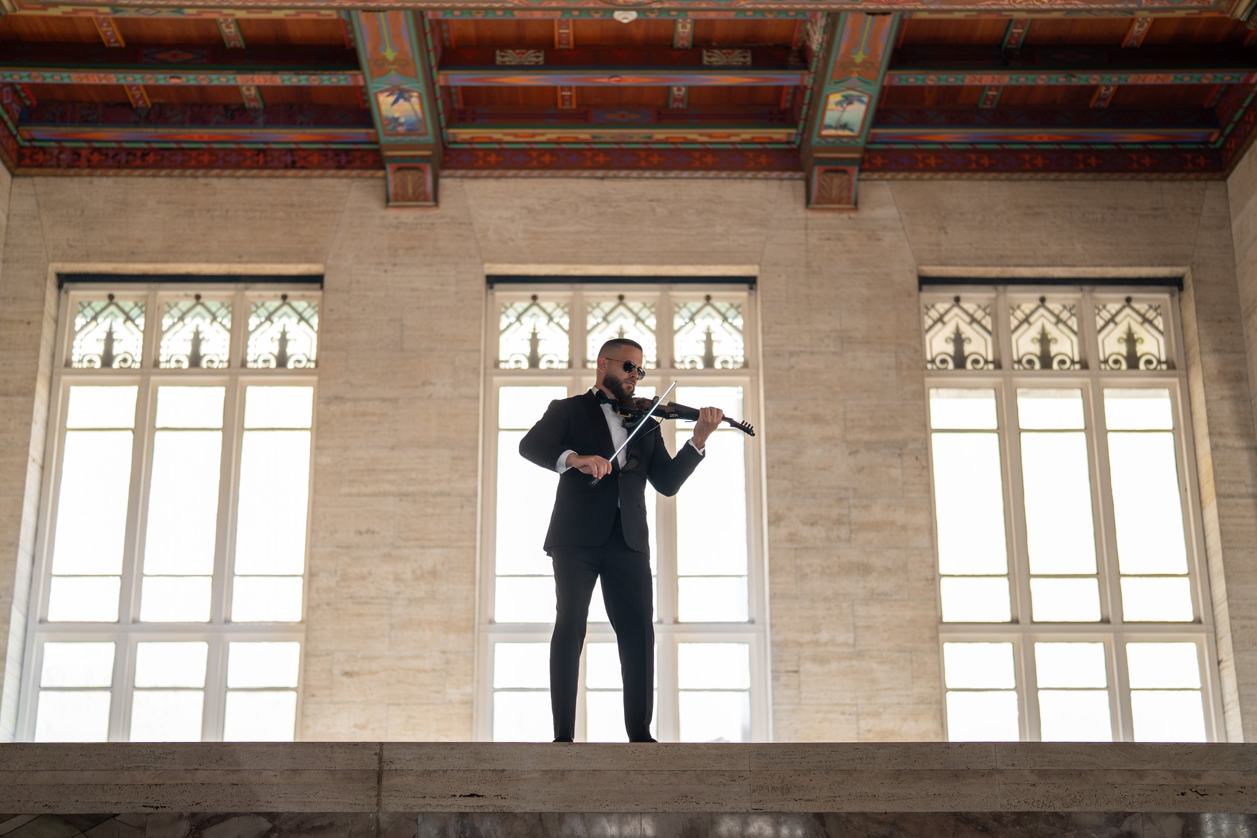 Corporate event violinist performing in Miami at The Historic Alfred I. duPont Building