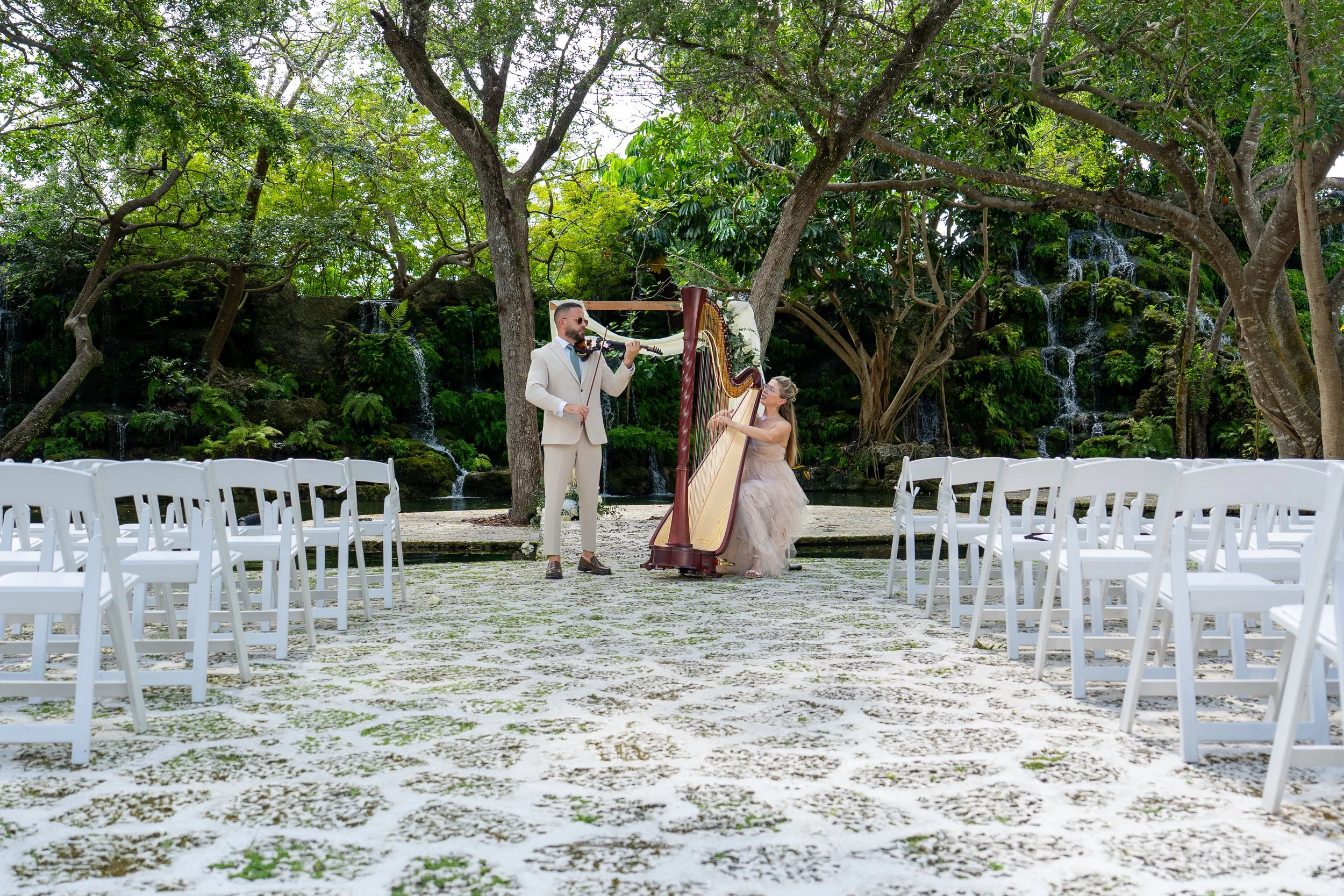 Violin and harp performing live wedding ceremony music at The Barn 305 in Miami