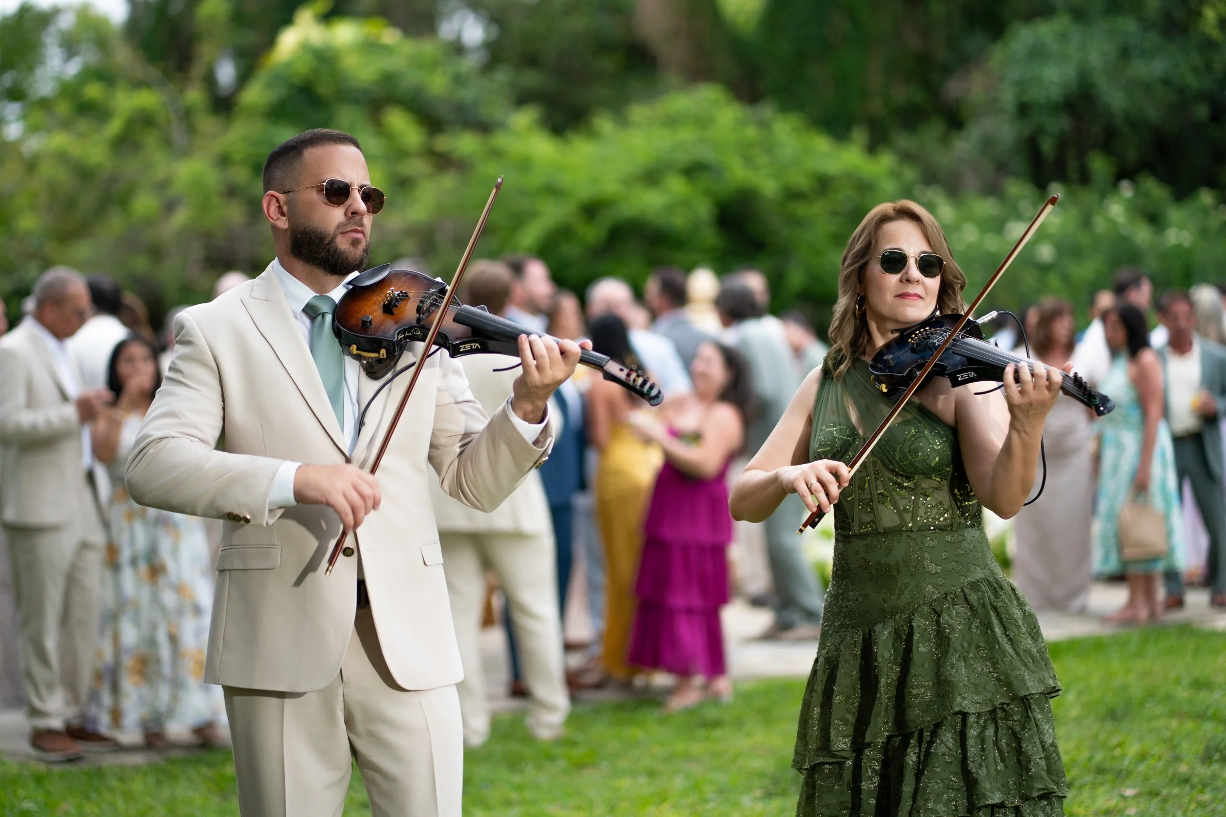 Violin duo performing during cocktail hour at The Ancient Spanish Monastery