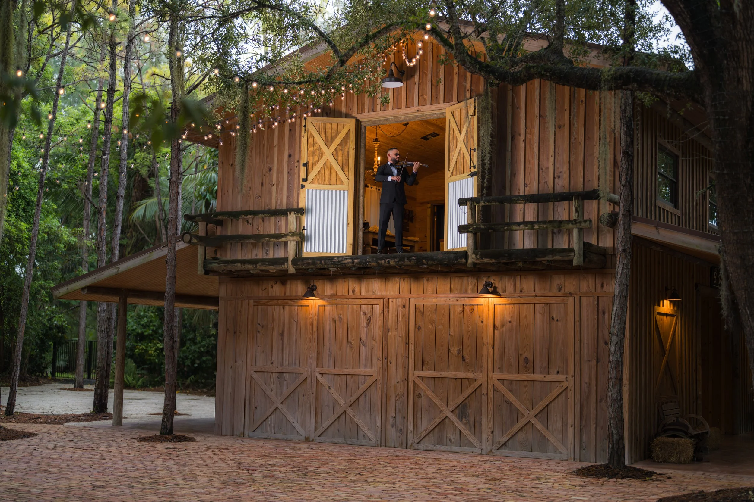 Wedding violinist performing live on balcony at The Barn 305 in Miami