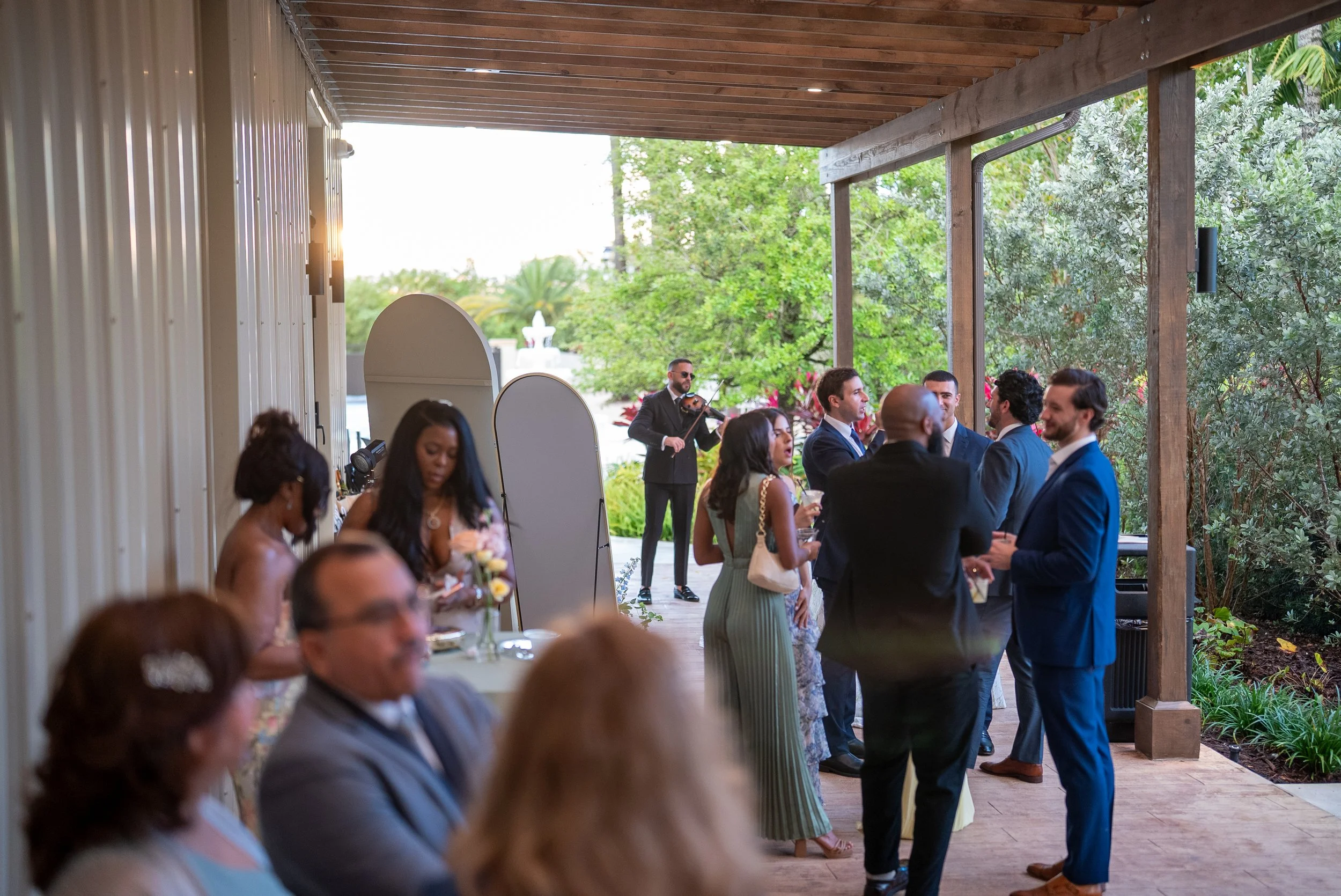 Guests enjoying cocktail hour at Gran Paraiso Gardens wedding in Miami