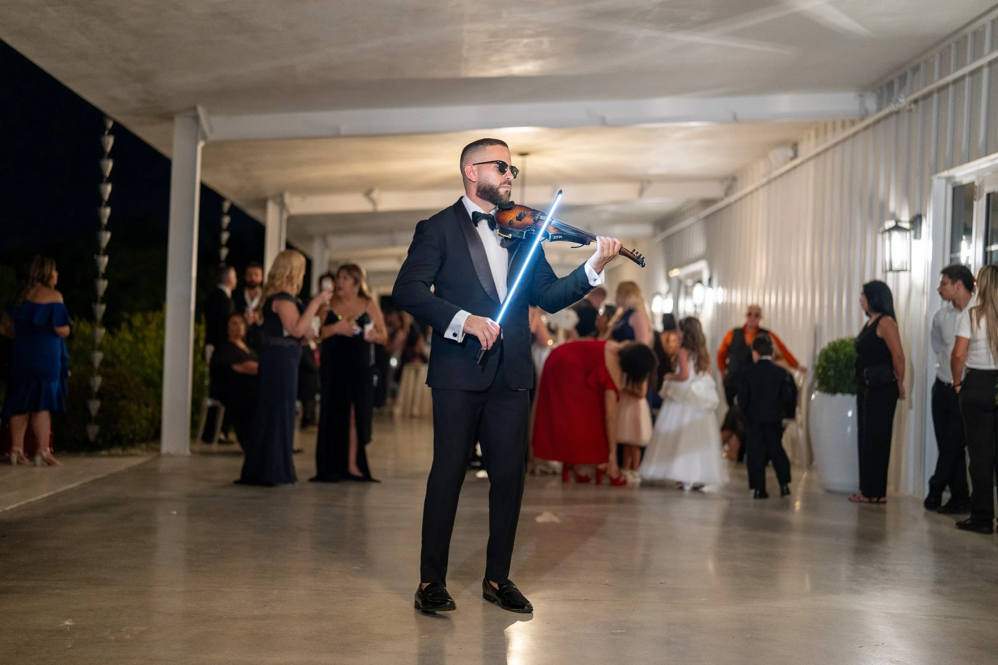 Miami violinist performing live during a wedding cocktail hour at The White Orchid