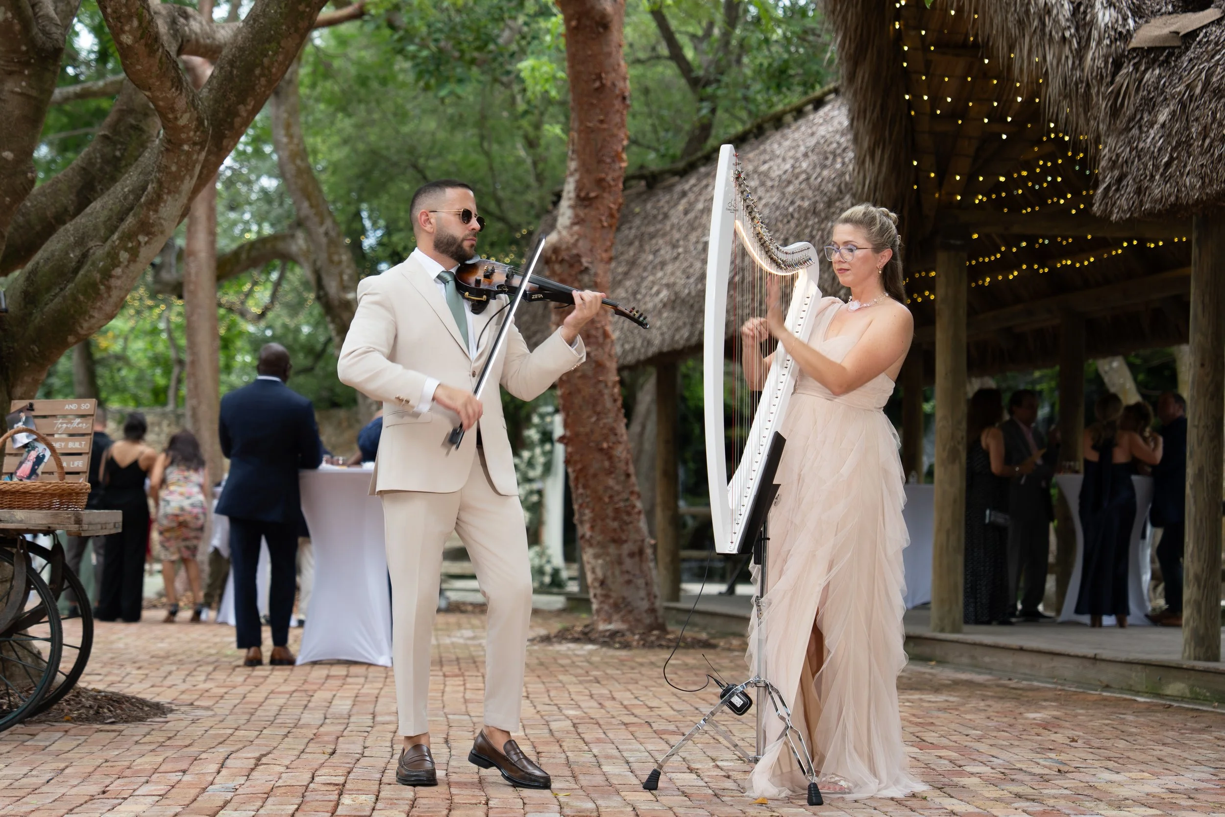 Elegant outdoor cocktail hour entertainment with violin and harp at The Barn 305