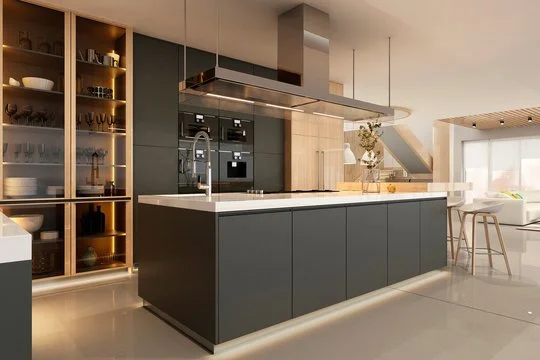 Modern kitchen with dark gray island, built-in oven, glass-front cabinets with dishes, and a seating area with high chairs near a large window.