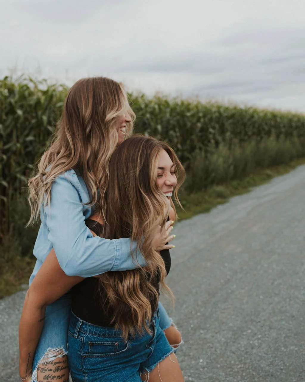 Two friends loving the outdoors with long dimensional blonde hair created by Destinee Horat
