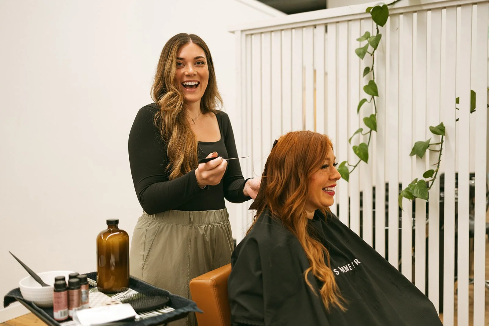Destinee Horat styling a client's hair in her Lynden, Washington salon