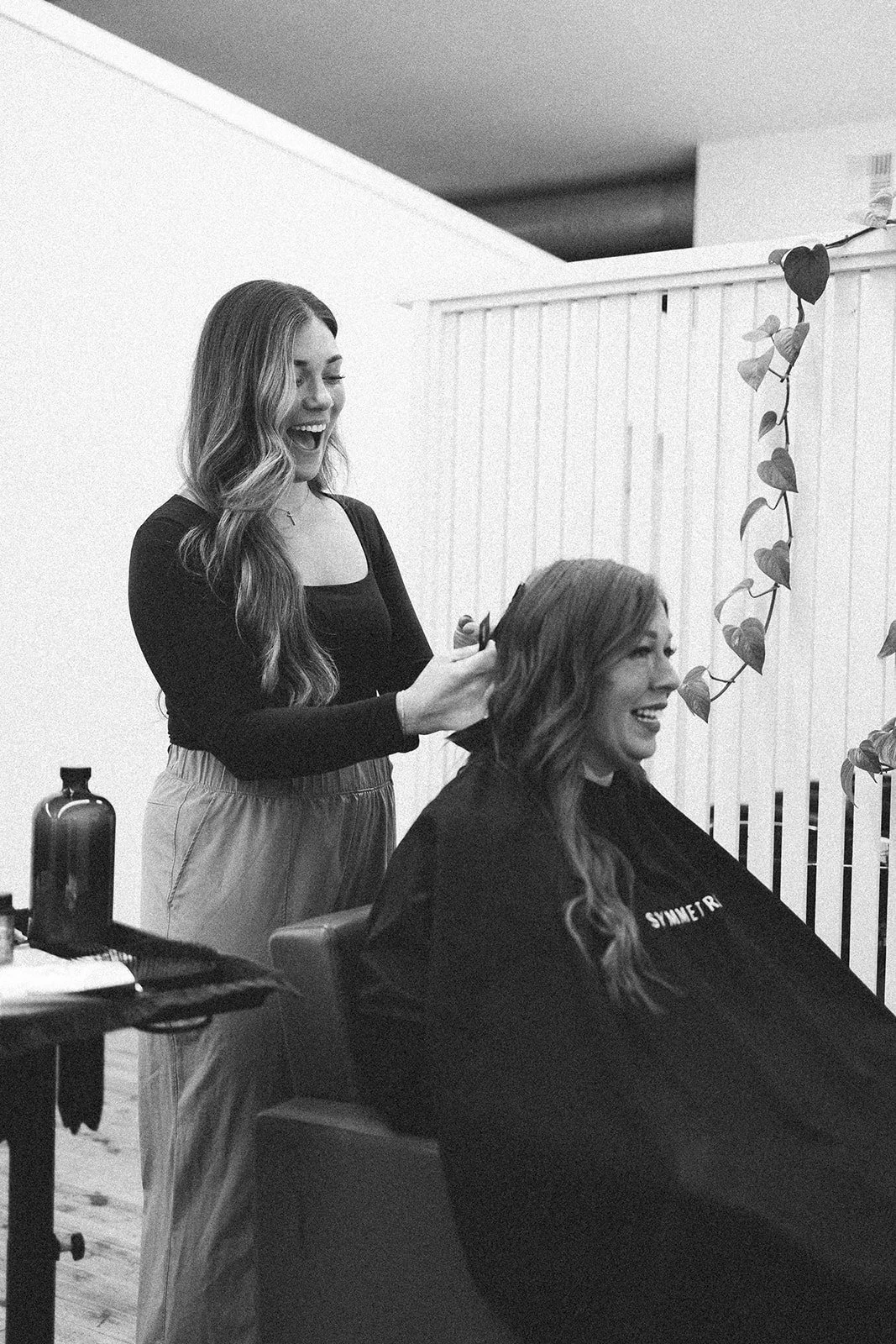 Destinee Horat working with a client during a personalized hair appointment in her salon