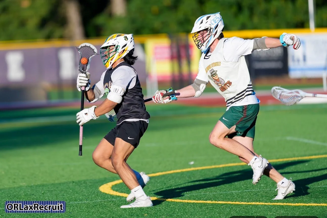Two players battle for position during a 2026 Men's Summer Cup semifinal. Photo: Jerry Winter, ORLaxRecruit