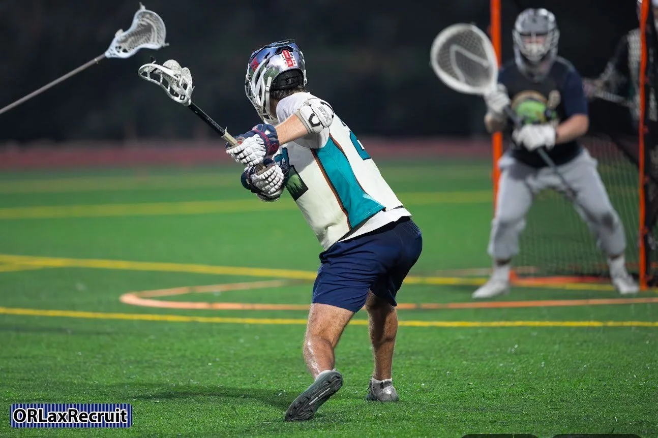 A Men's Summer Cup player winds up to shoot in front of the goal in 2026. Photo: Jerry Winter, ORLaxRecruit