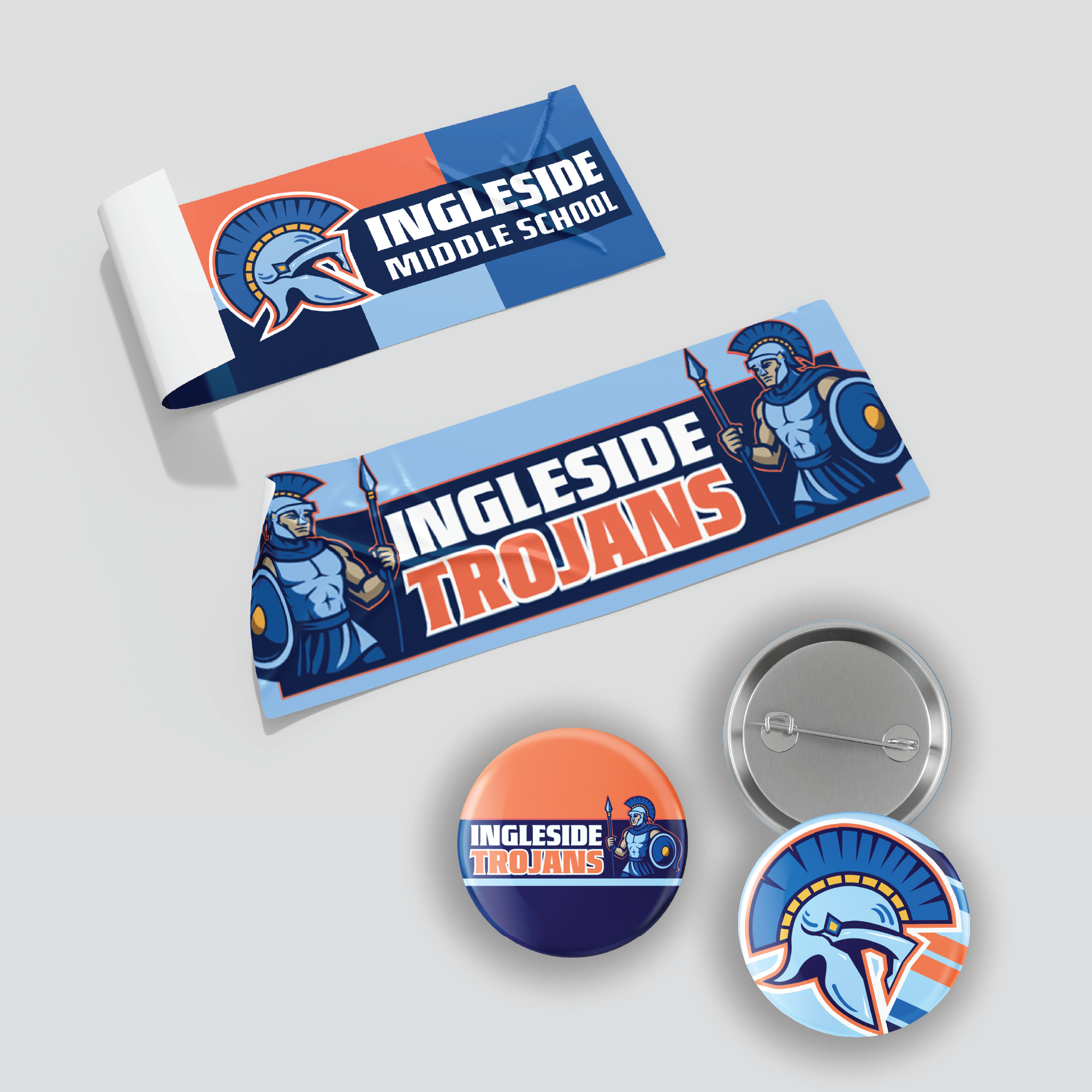 Range of promotional materials including banners, stickers, and buttons, applying the identity across different formats and sizes.