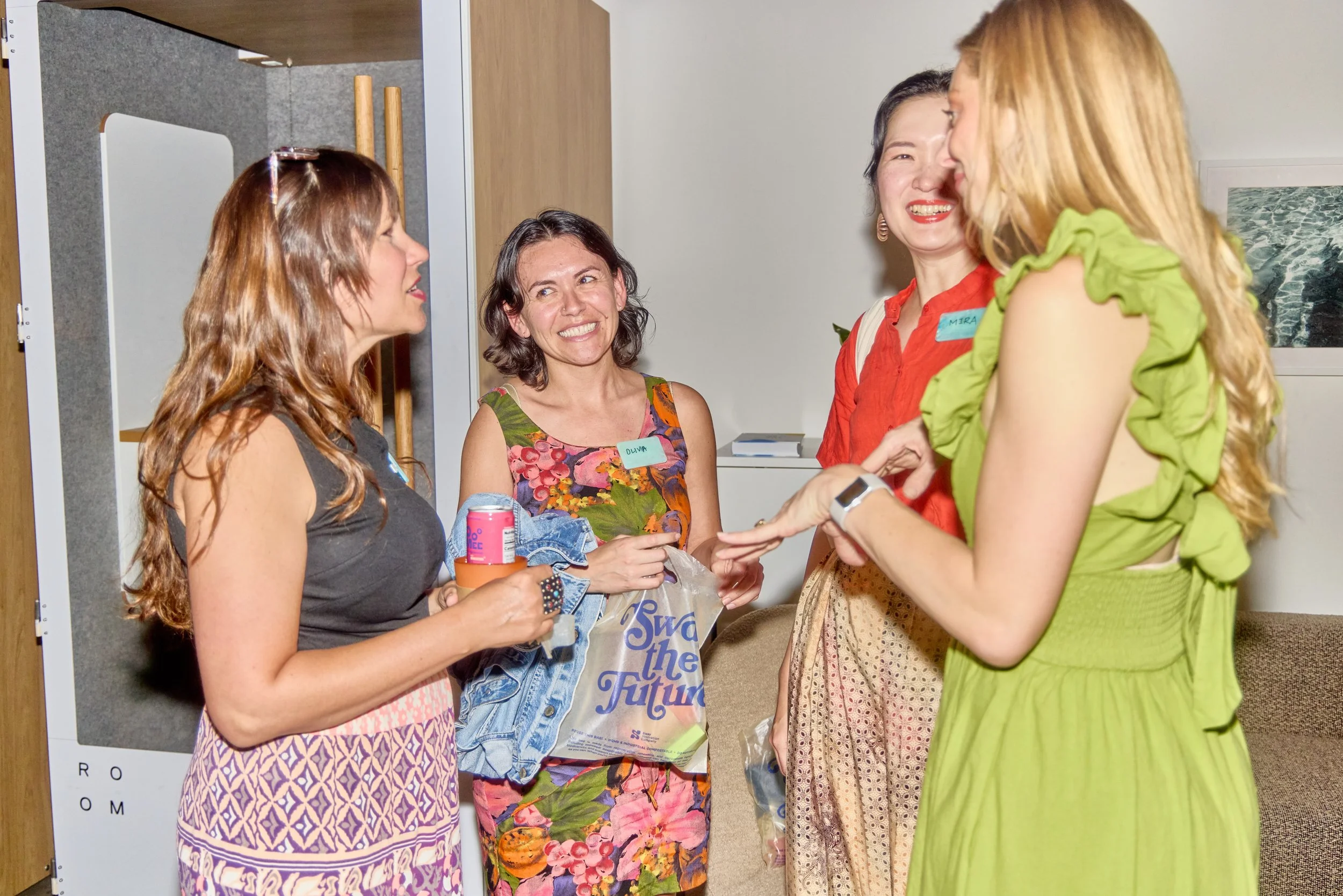 Attendees at a corporate event wearing Unwaste reusable name tags 