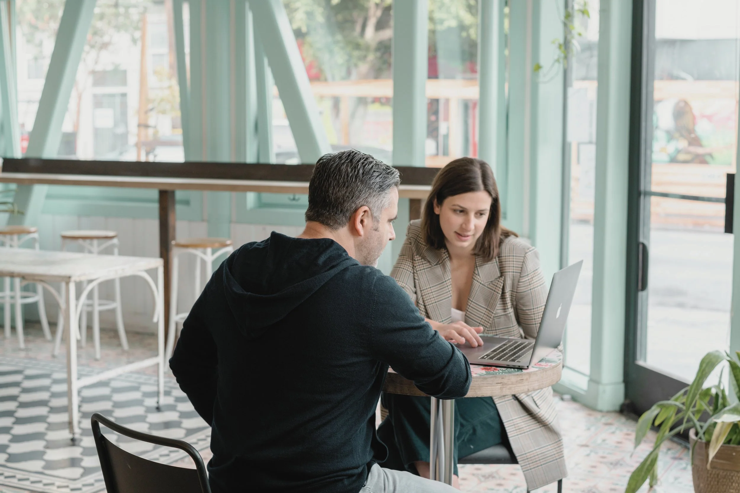 Two people meeting and discussing business opportunities in Victoria, BC