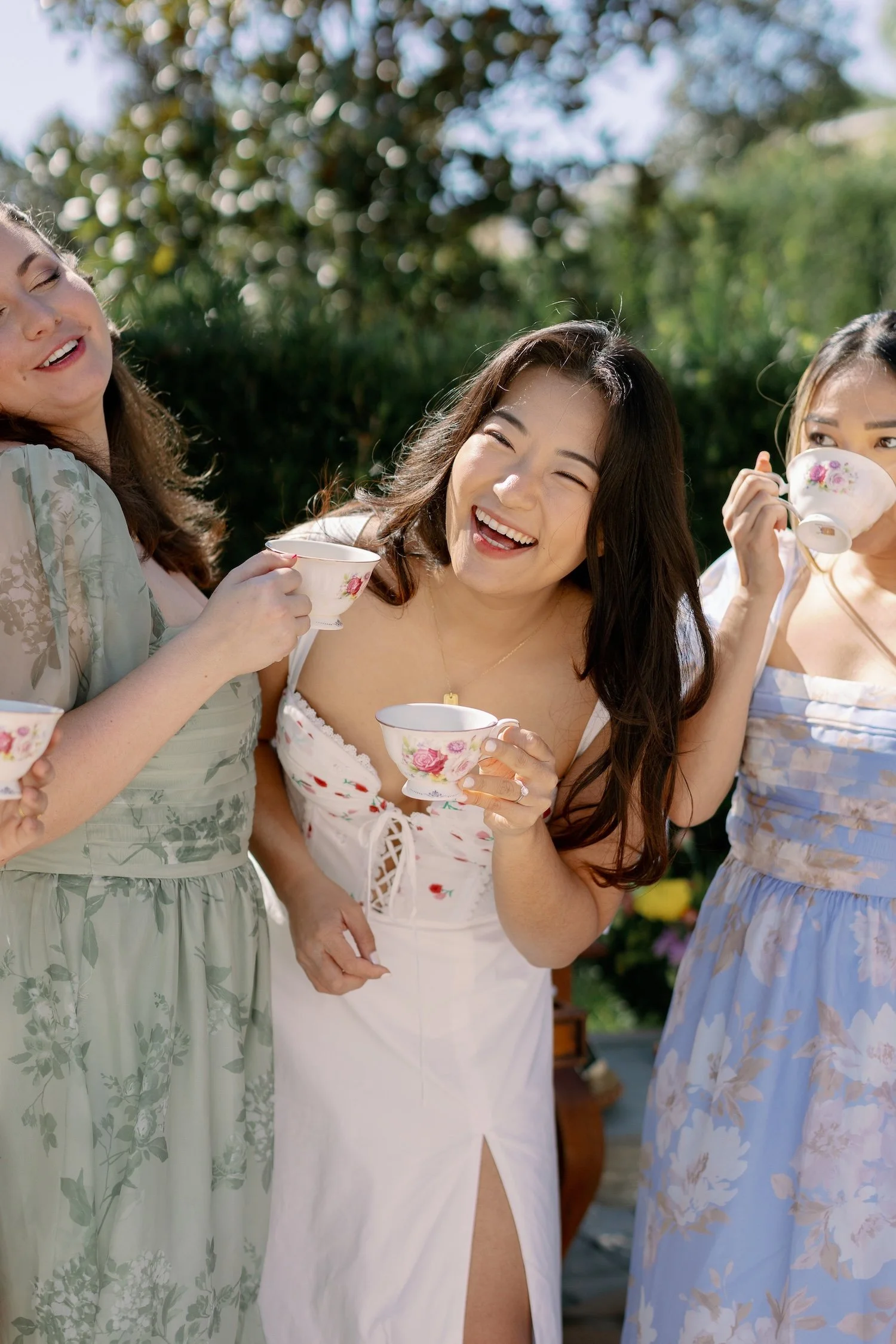 group of women laughing drinking tea