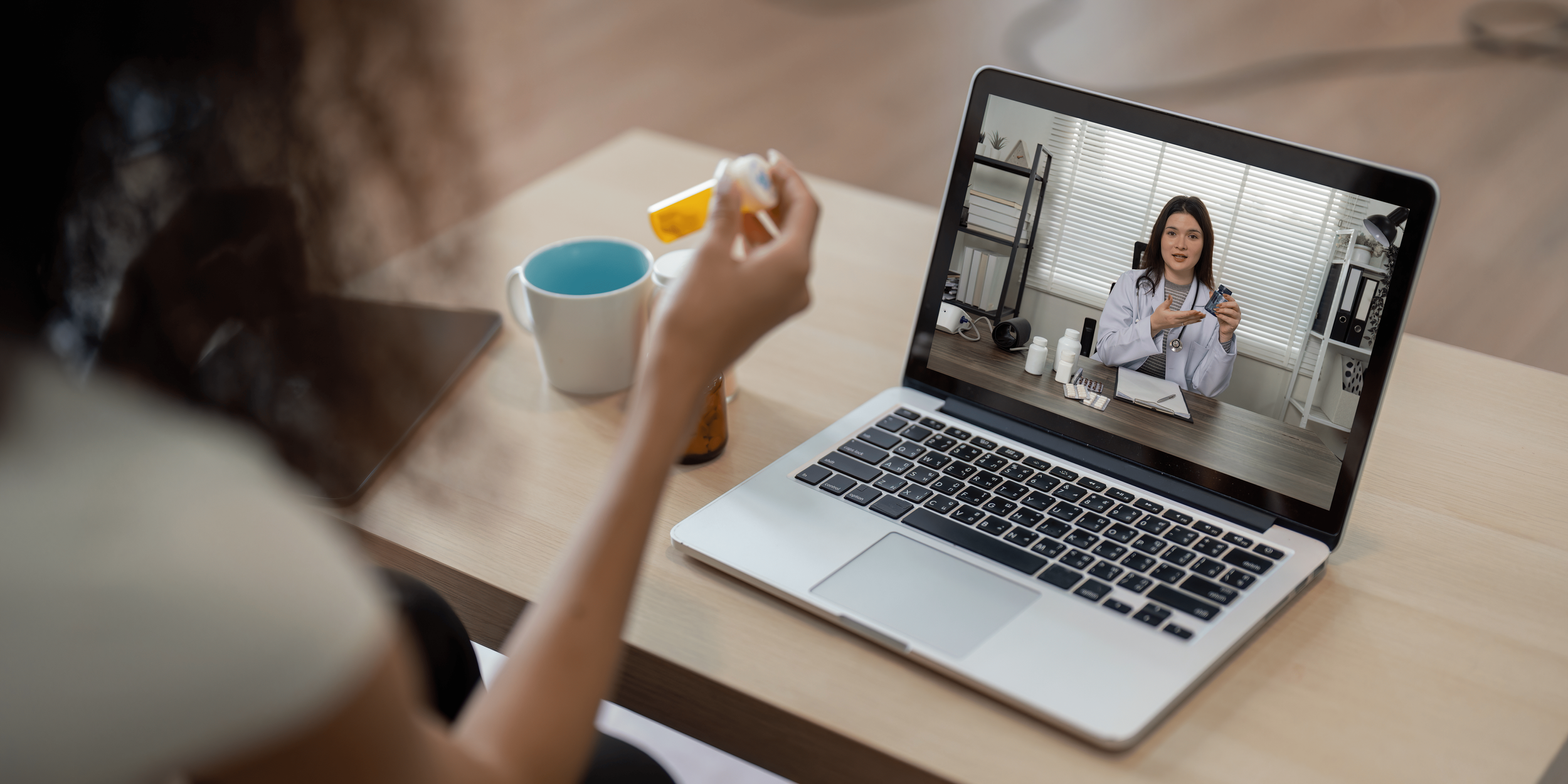 Woman on a telehealth video visit as a provider explains next steps, reflecting Regenyx's personalized care approach.