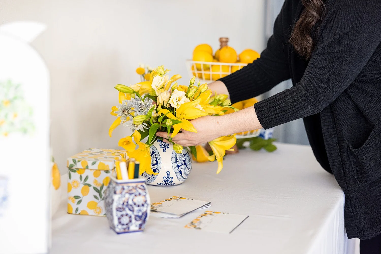 wedding planner sets up decor for event