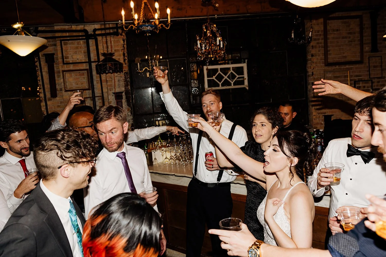 wedding party doing a toast after their ceremony