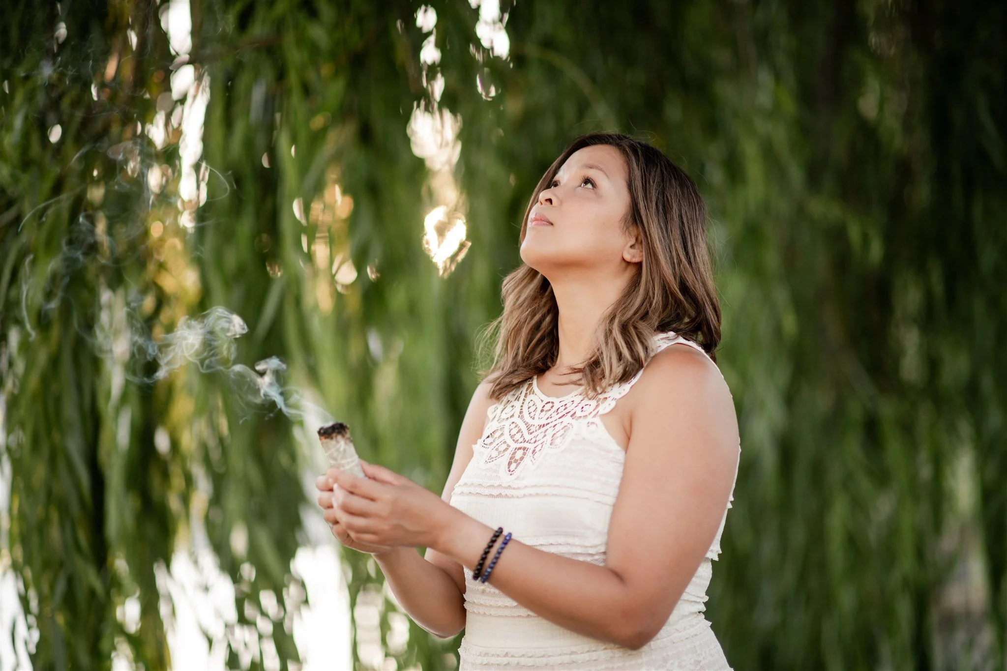 Grace Killpack of Apo Acupuncture in Orinda, CA, burning sage.