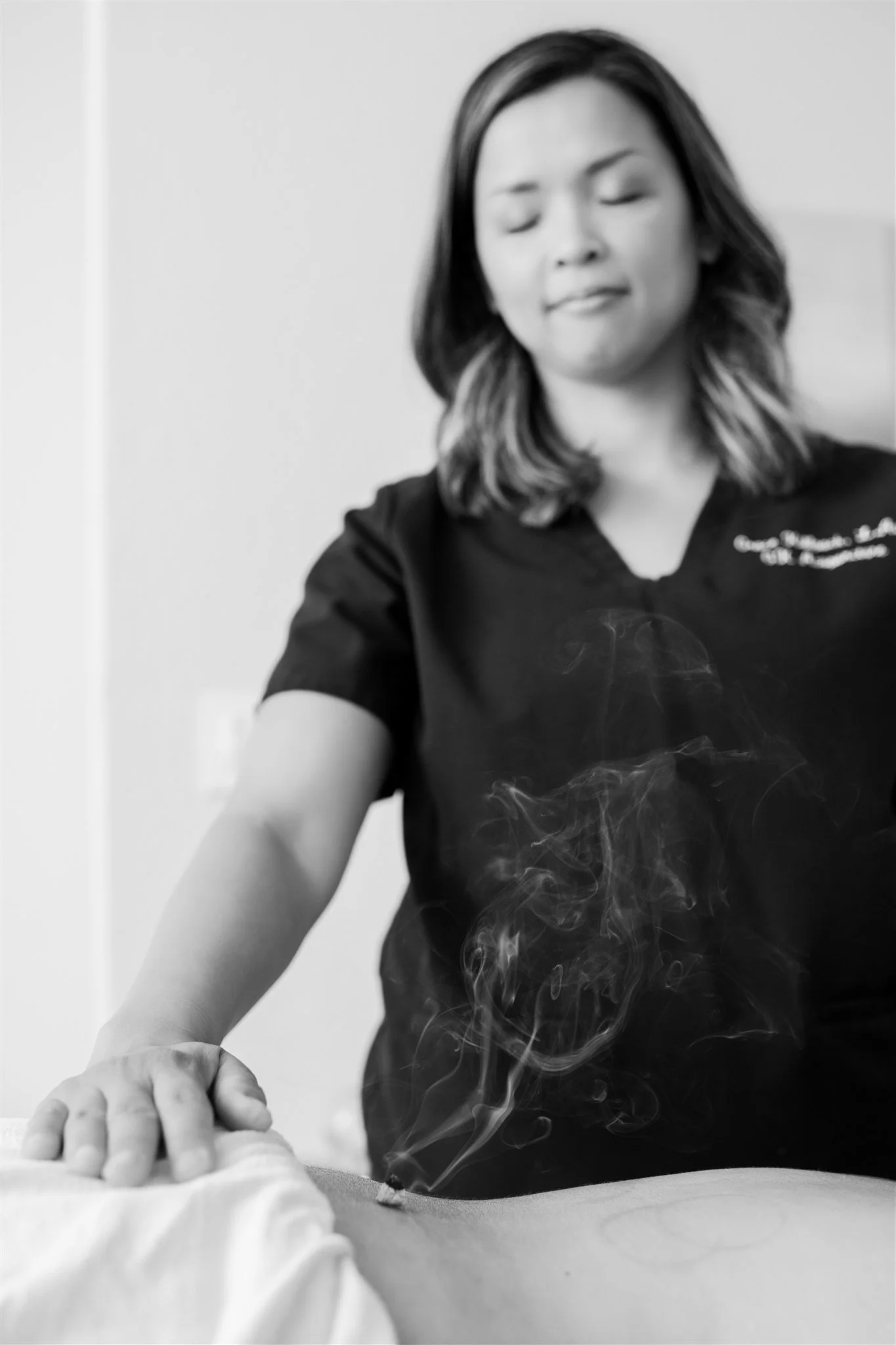 Acupuncturist Grace Killpack treating back pain at her clinic Apo Acupuncture near Lafayette, CA.