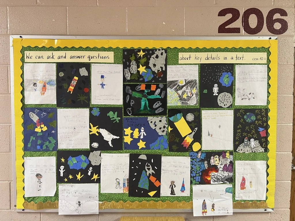 A class's art work included in their drawings and writings about Mae Jemison