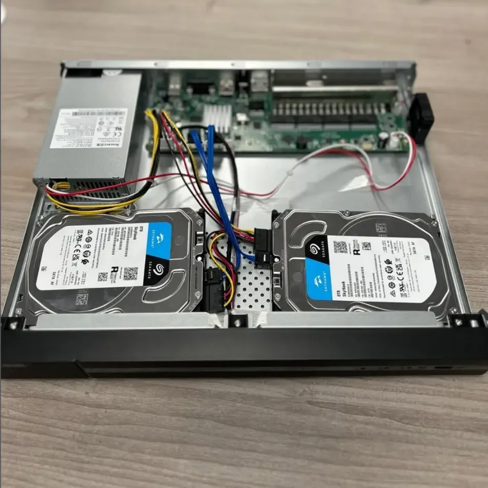 Open desktop computer with two installed internal hard drives, power supply, and motherboard visible.