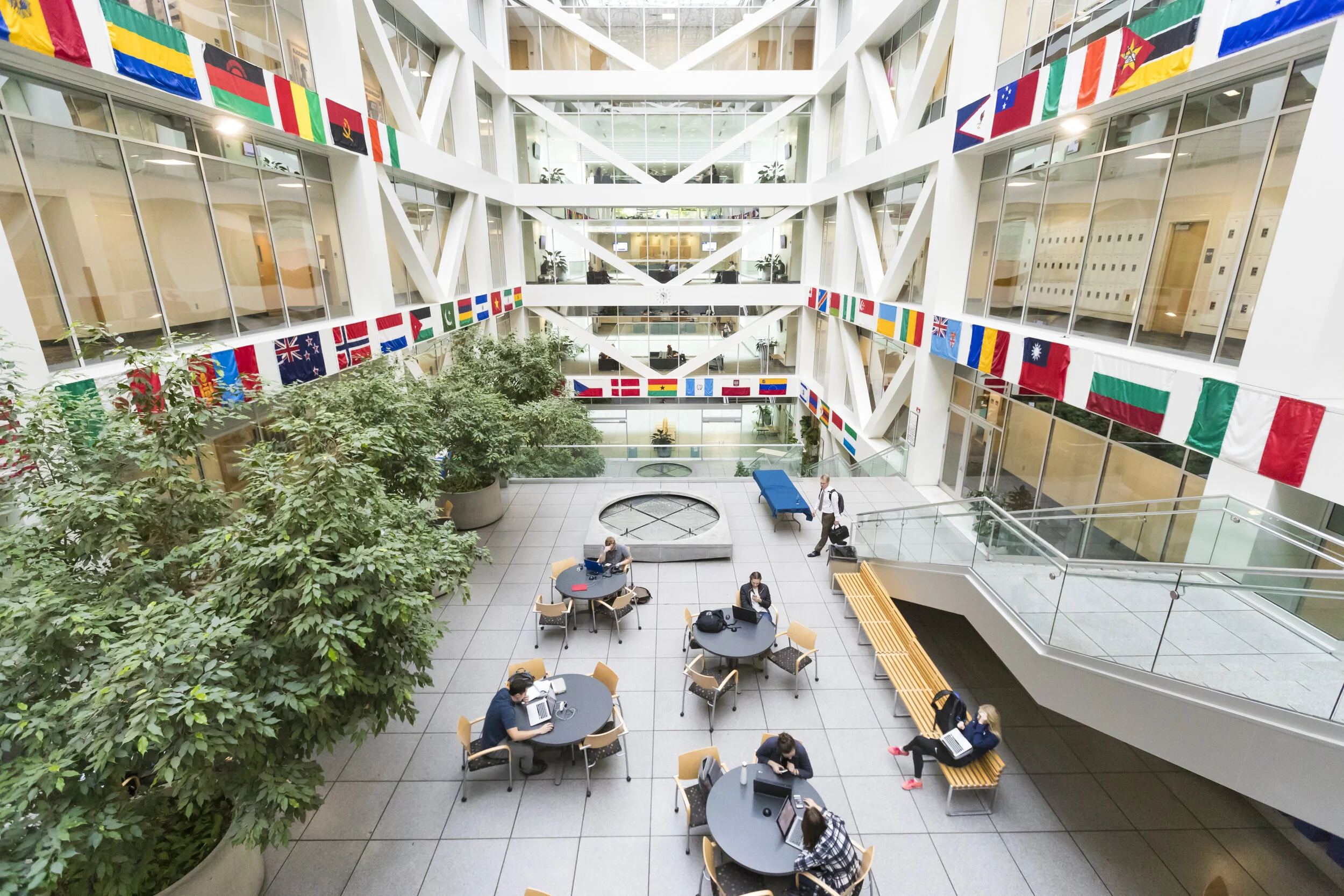 The flags in the Tanner Building atrium are representative of several international projects the lab has completed.