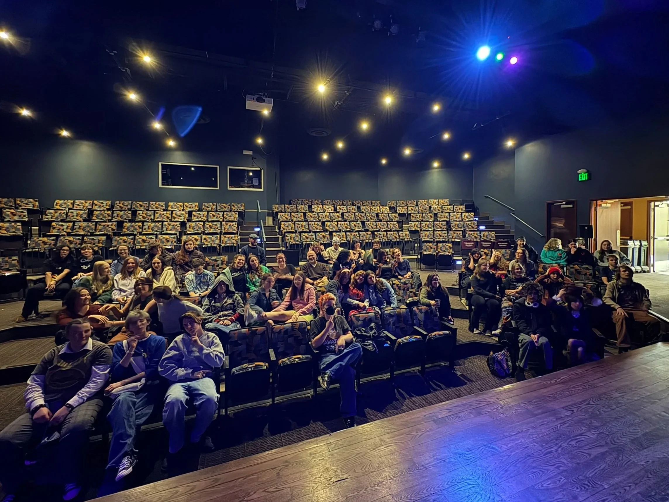 Poudre School District students seated in theater learning about technical theater careers during Tech Career Day at the Lincoln Center