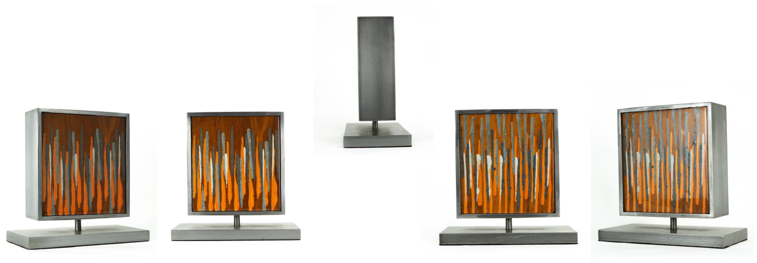Five decorative table lamps with square bases and metallic stands, featuring abstract orange, gray, and silver painted designs on square shades, arranged in a row against a white background.