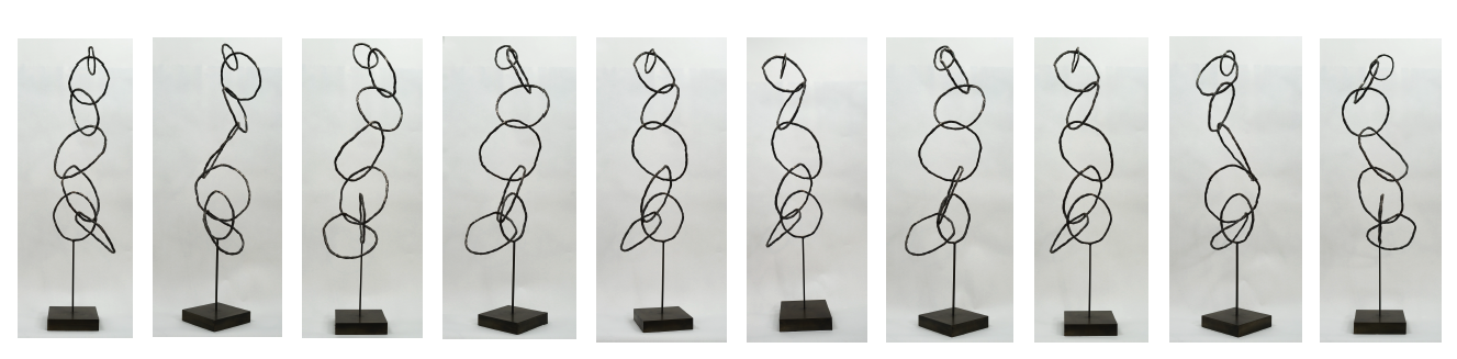 Sculptural art piece with a black wire loop design on a black base, displayed in multiple different angles.