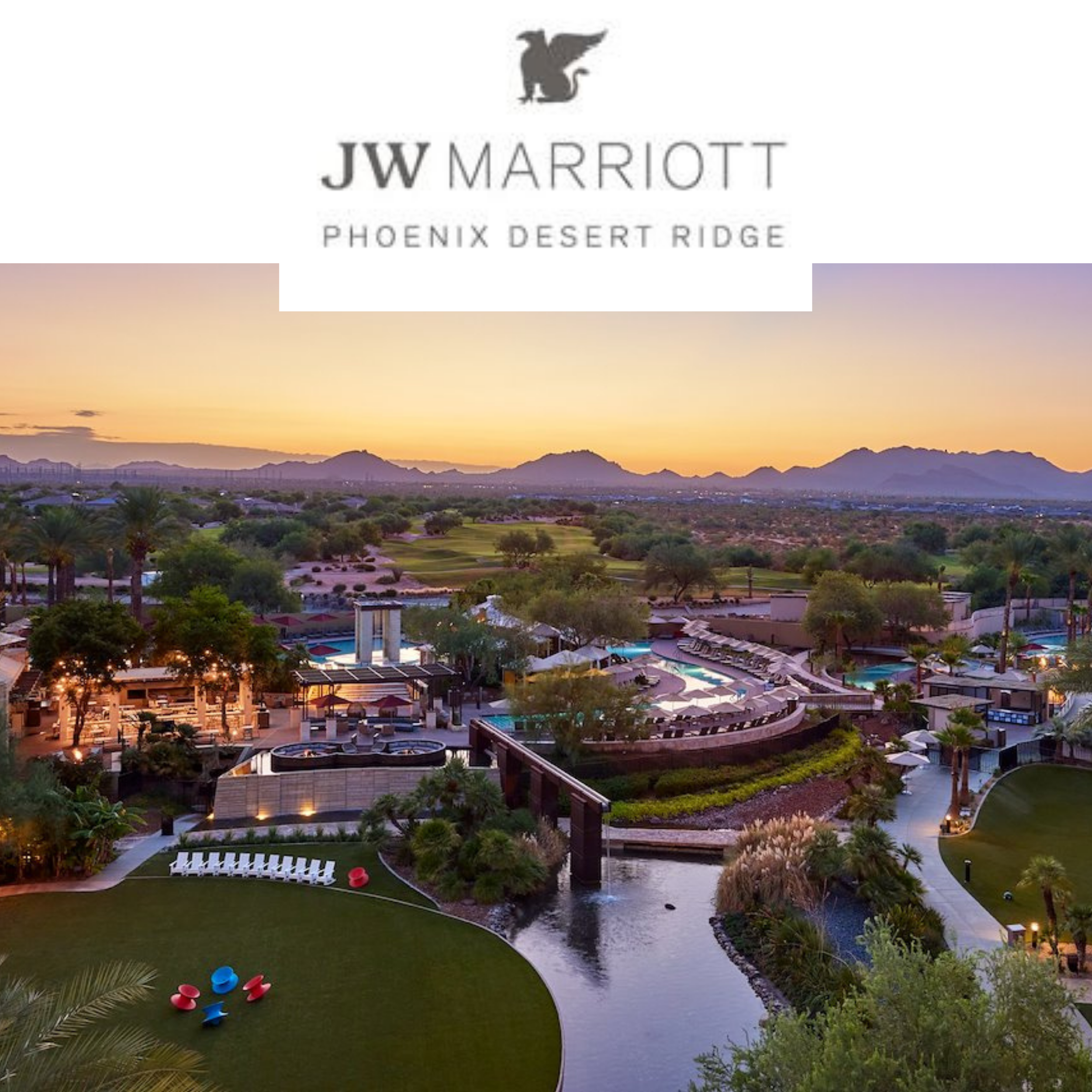 Aerial view of JW Marriott Phoenix Desert Ridge resort at sunset, featuring pools, lush greenery, and mountains in the background.