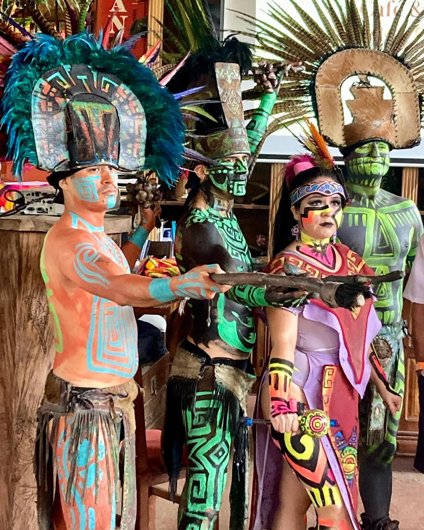 Cacao y Vanilla fiesta in the garden with pre-Hispanic dance. The chocolate tree has sweet colorful minuscule flowers that bloom and fruit directly on the trunk and large branches. Mosquitoes are its sole pollinator. The pulp surrounding the seeds of