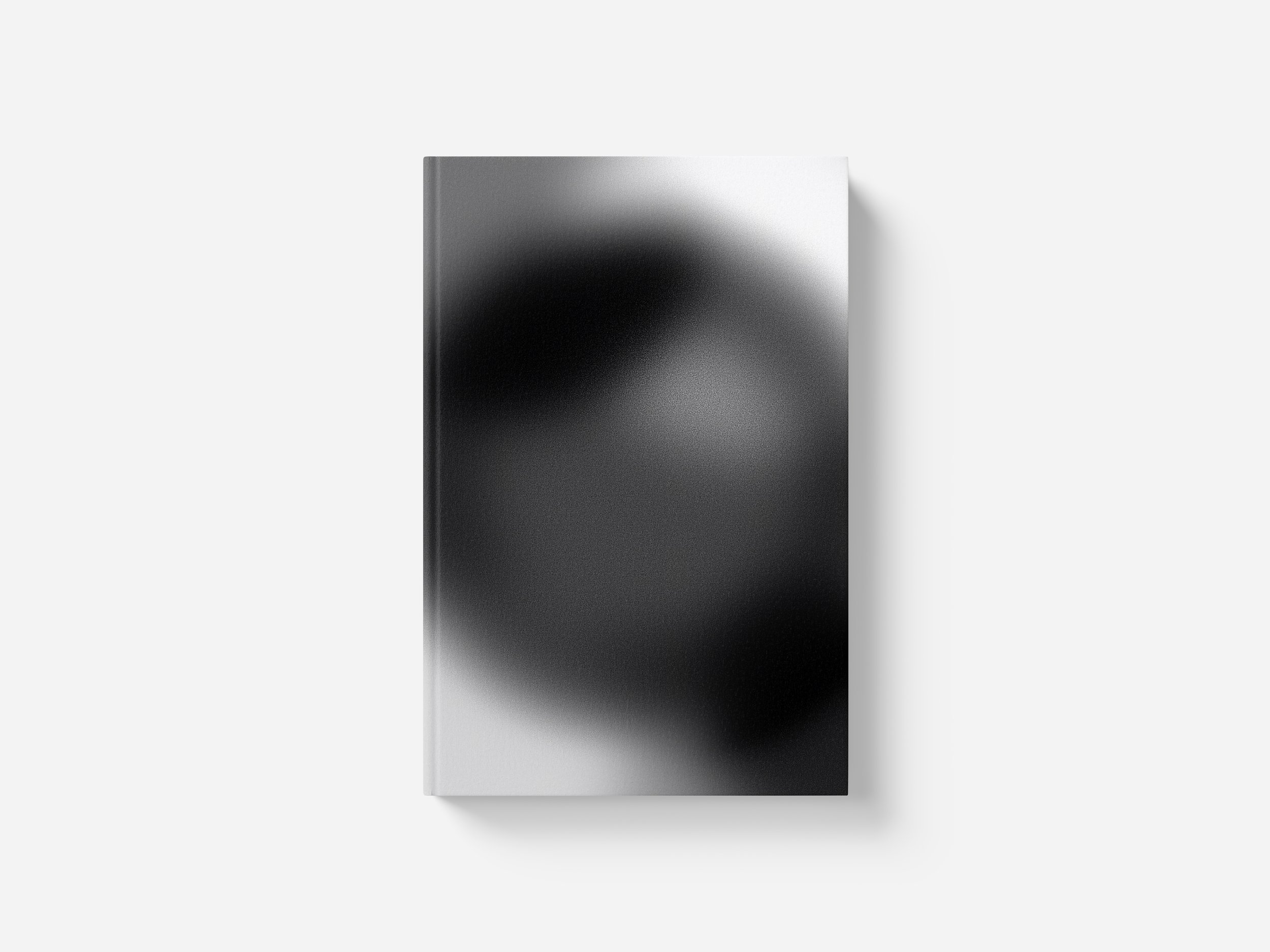 A sleek, rectangular, metallic electronic device with a gradient black-to-white background.