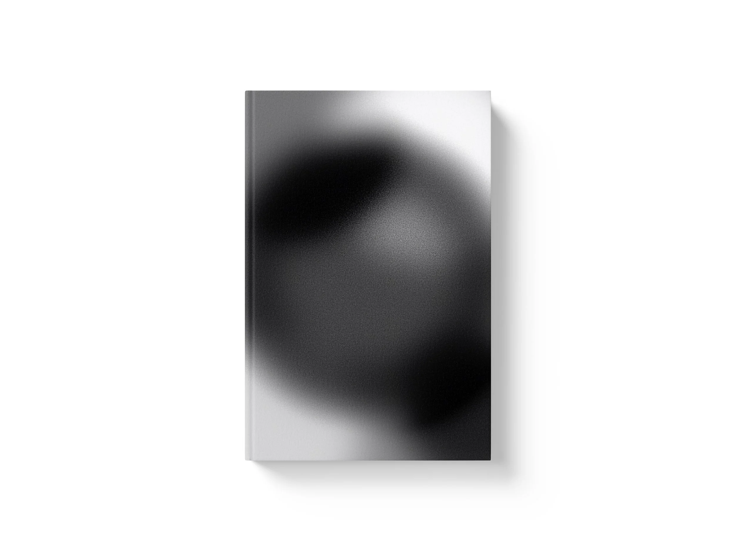 A sleek, modern, rectangular device with a dual-tone surface of gradient black and silver, featuring a metallic finish, casting a shadow on a white background.