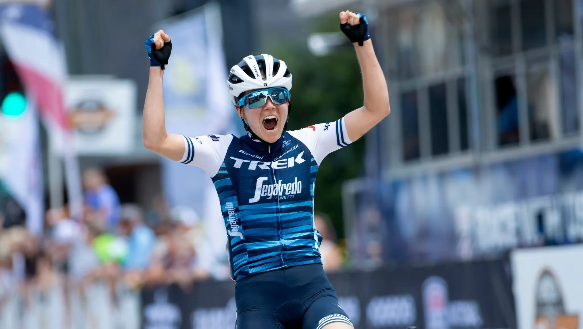 Professional cyclist Ruth Winder celebrating on the finish line.