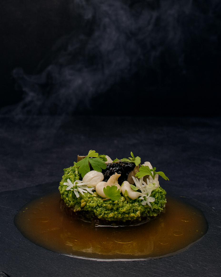 Beef tartare with pickled shimeji mushrooms, herb crumb, truffle, caviar, and warm potato consommé — a refined balance of texture and umami. A signature JustInc. private chef tasting menu creation enjoyed across South England.