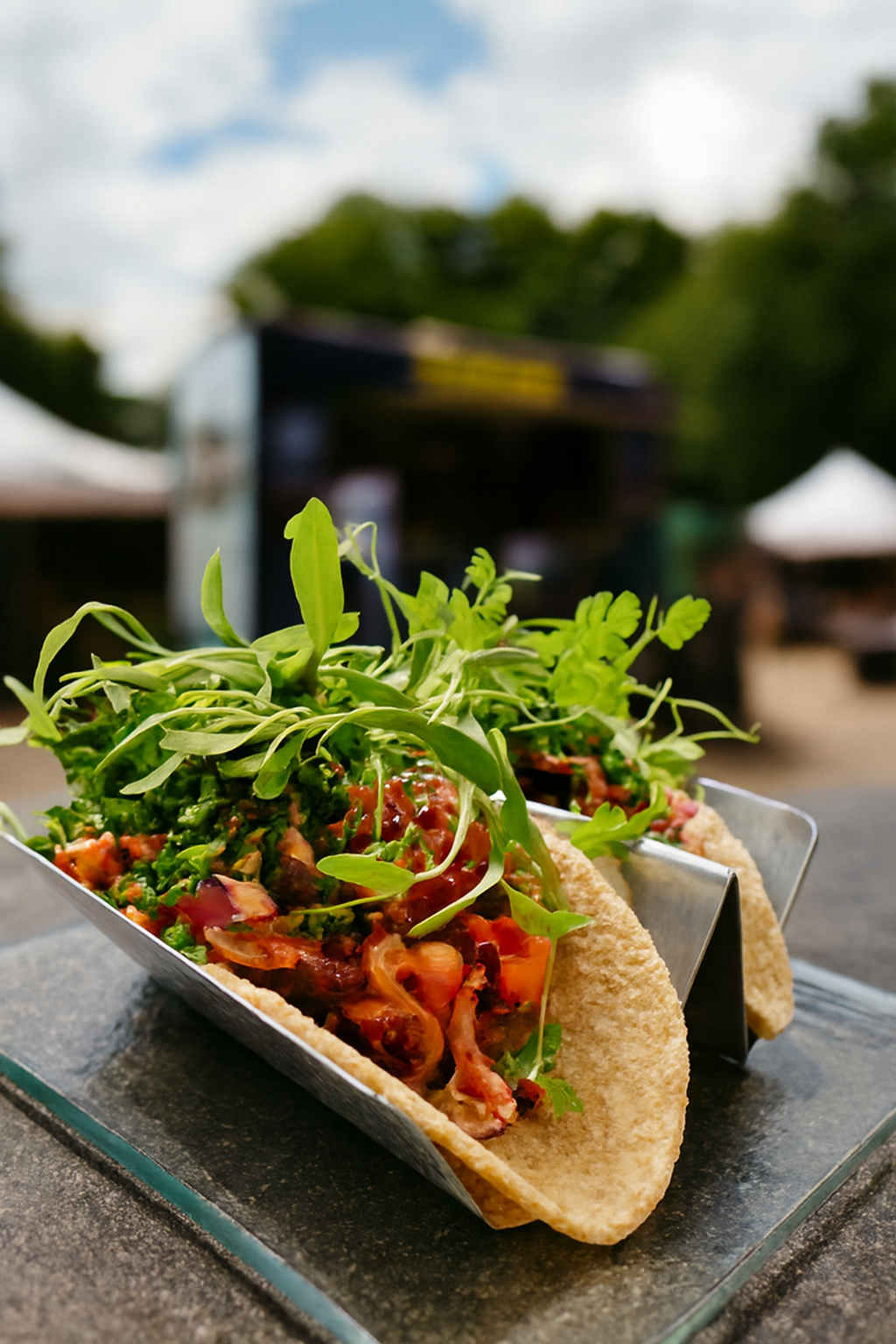 Pulled pork tacos filled with diced tomatoes, fresh greens, and topped with vibrant microgreens. Served outdoors on a metal tray, this dish captures flavour, freshness, and flair a JustInc. private chef creation enjoyed across South England.