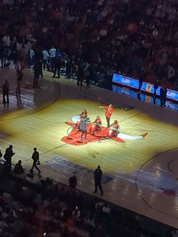 In the nosebleeds with the boy at United Center watching the Chicago Bulls. Had to get my DRose figurine!