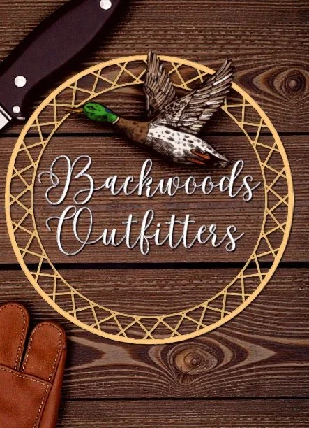 Decorative sign with a duck decoy and the text 'Backwoods Outfitter' on a wooden surface.