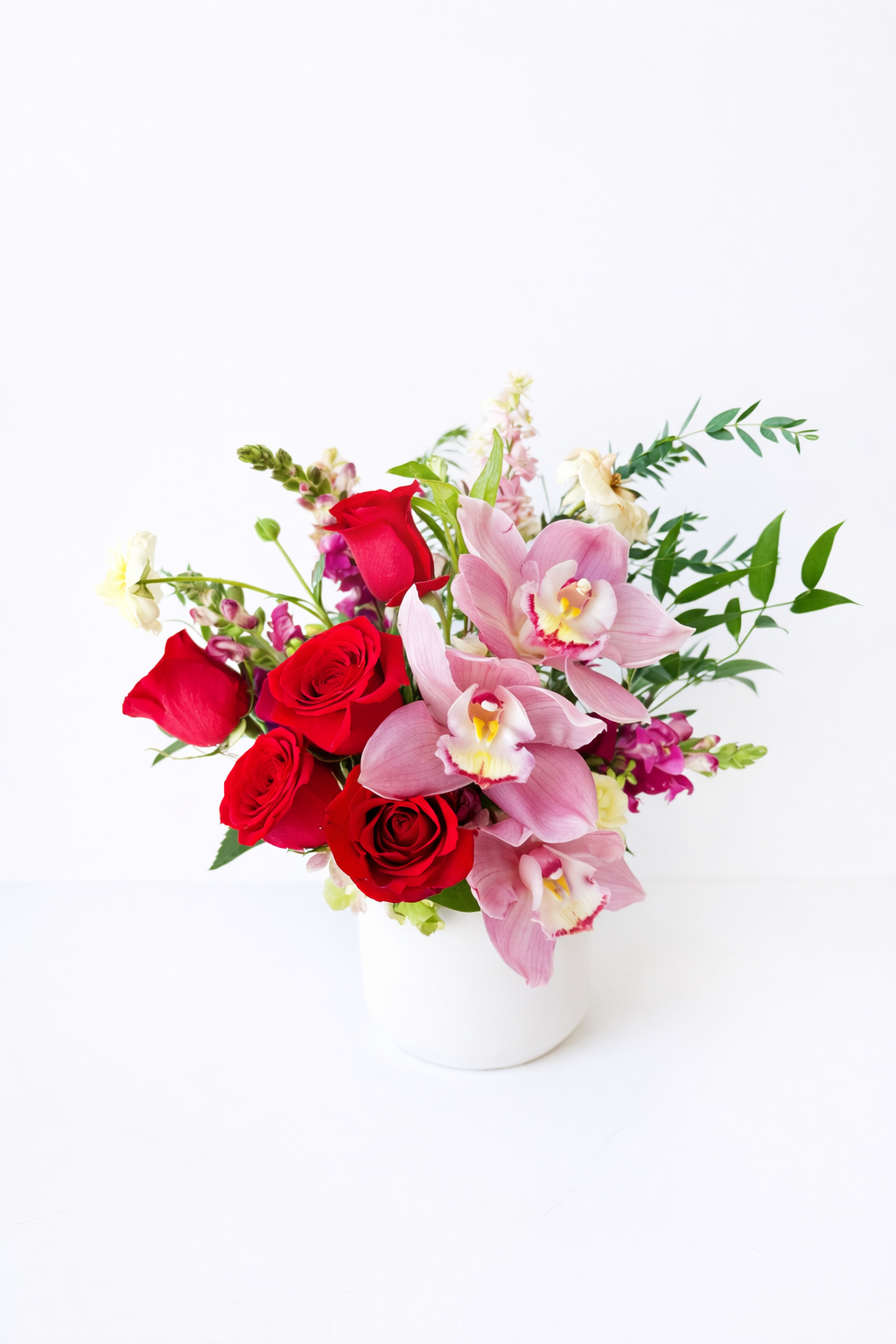 Orchid and rose in white vase 1.png
