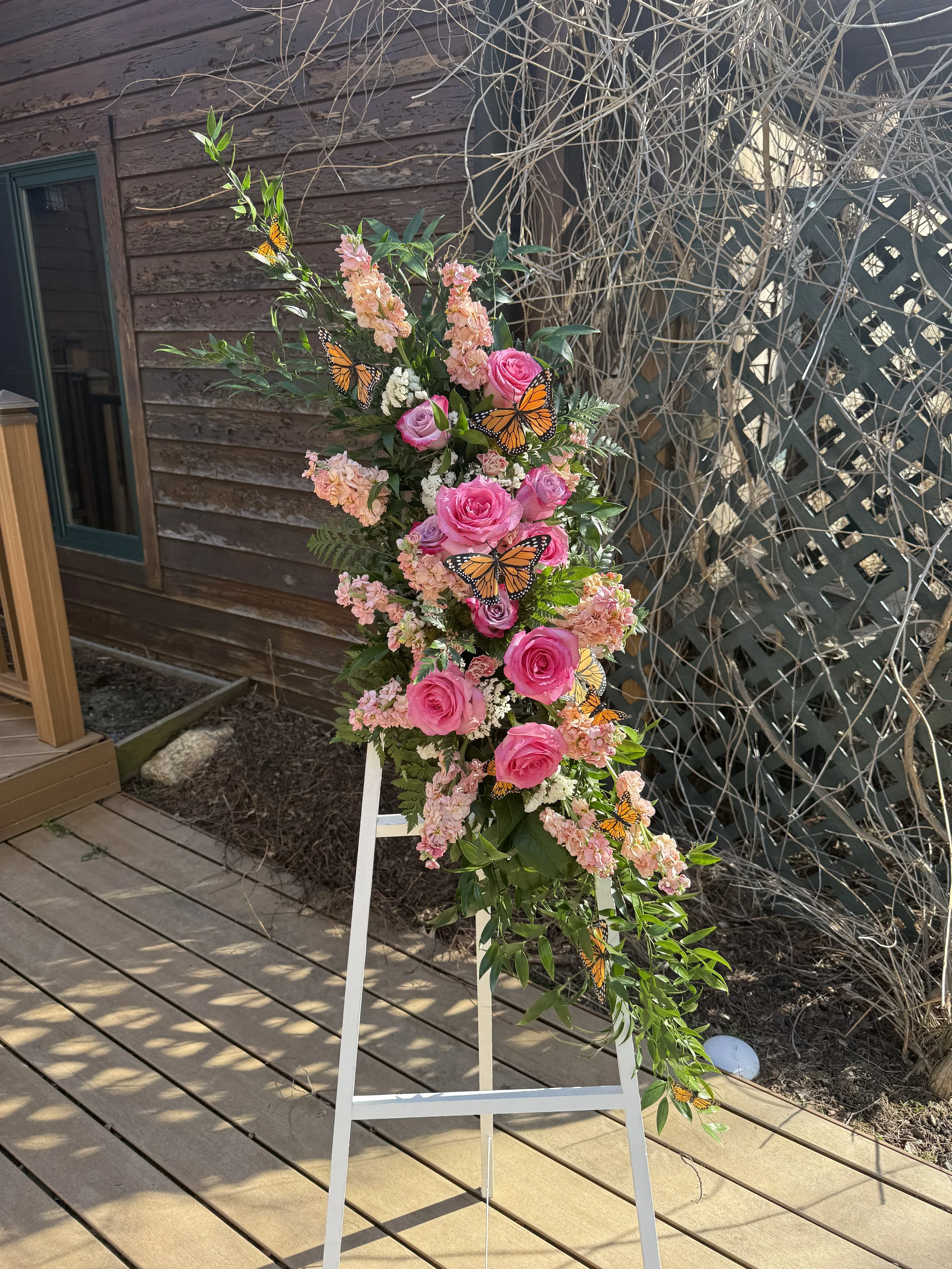 Springtime standing floral wreath on white easel 2.JPG