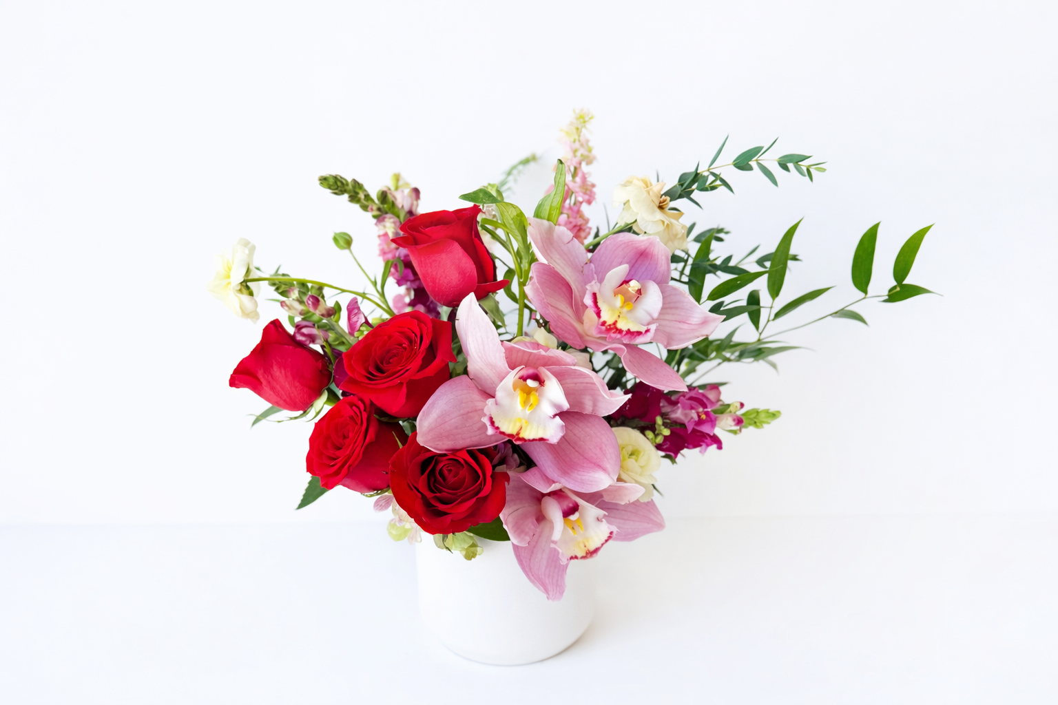 Orchid and rose in white vase 2.png