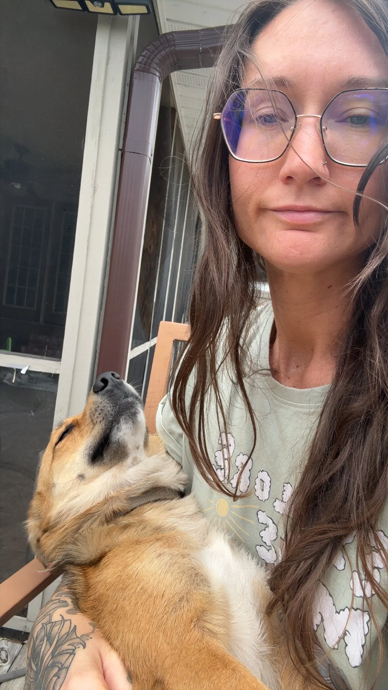 Ashana Kaiulani smiling with a dog