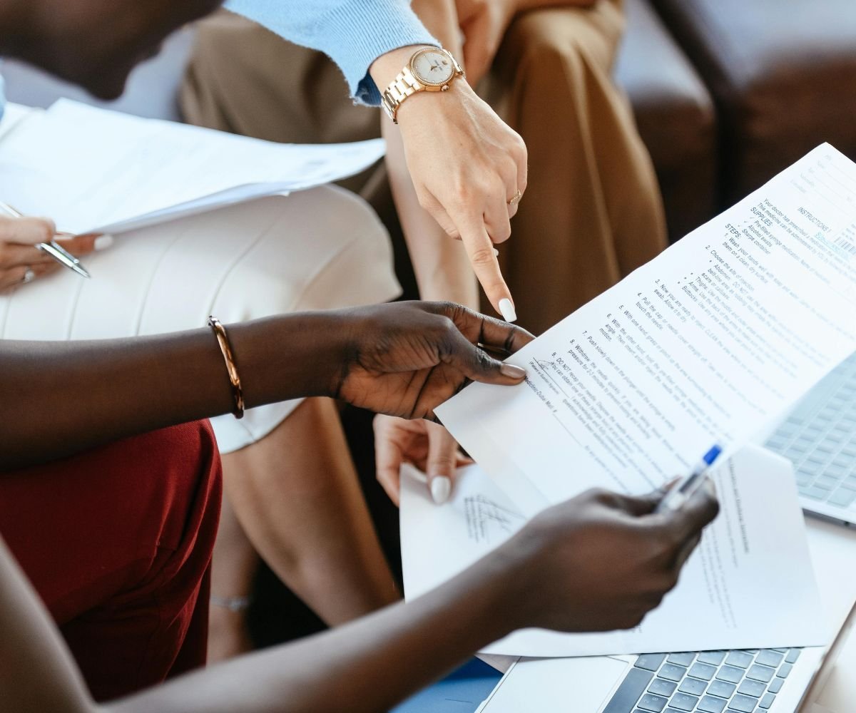 Nonprofit team reviewing a grant proposal with a grant writing consultant in Richmond, Virginia.