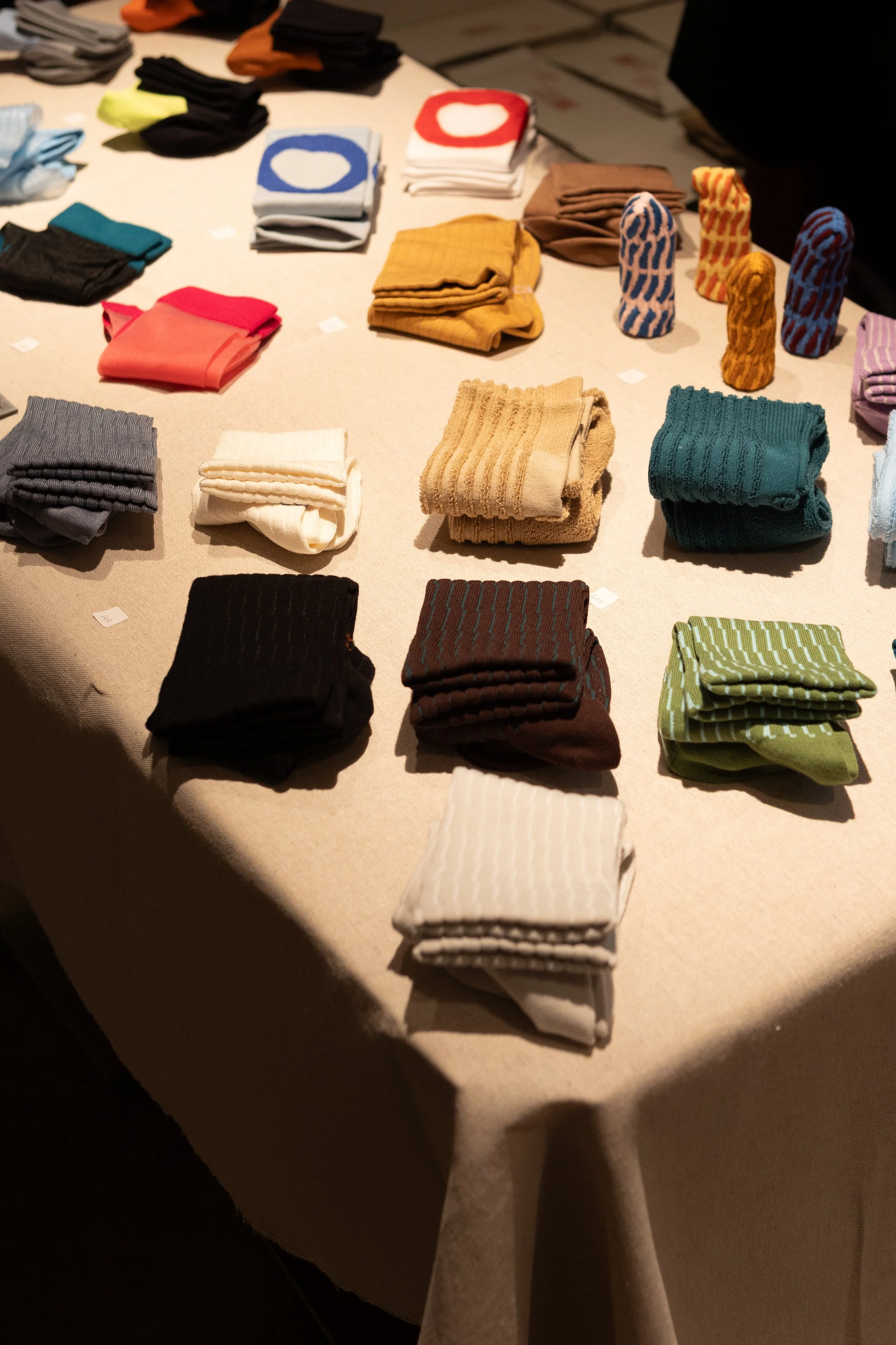 Editorial — curated socks display from a Hong Kong independent shop, Social Goods Modern Bakery community feature.