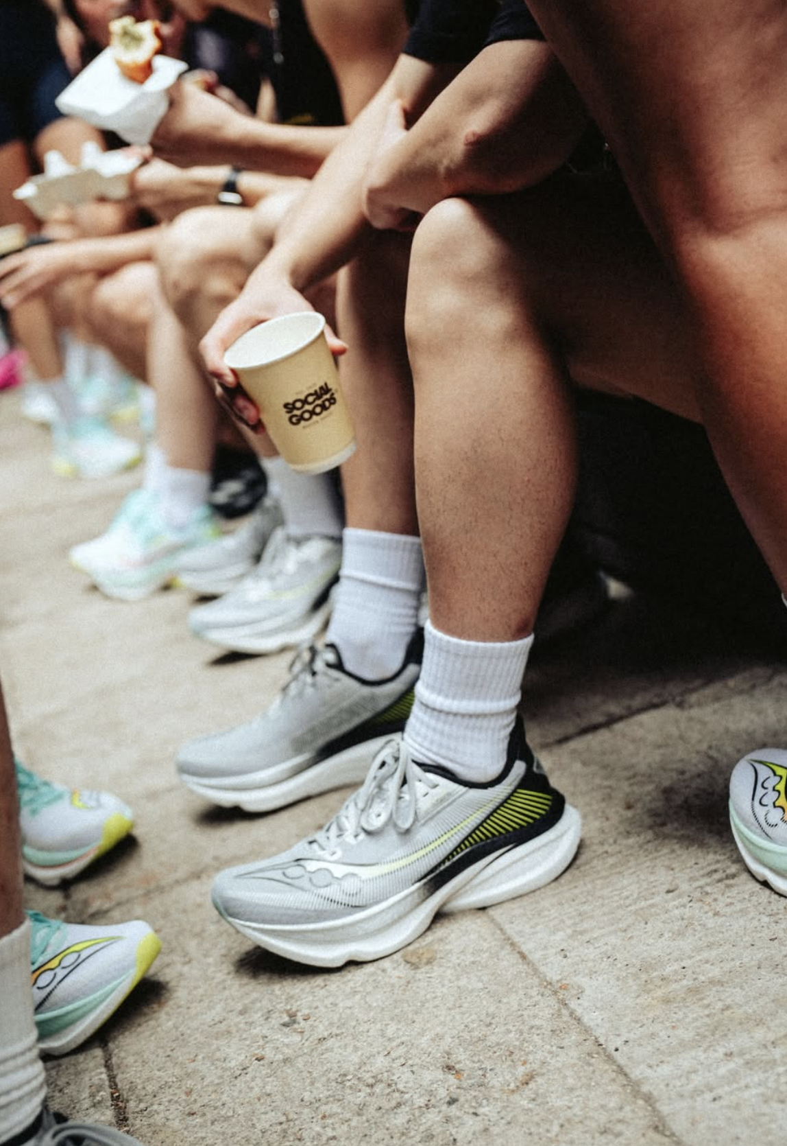 Run club members refuelling outside Social Goods Modern Bakery Central after a Hong Kong morning run.