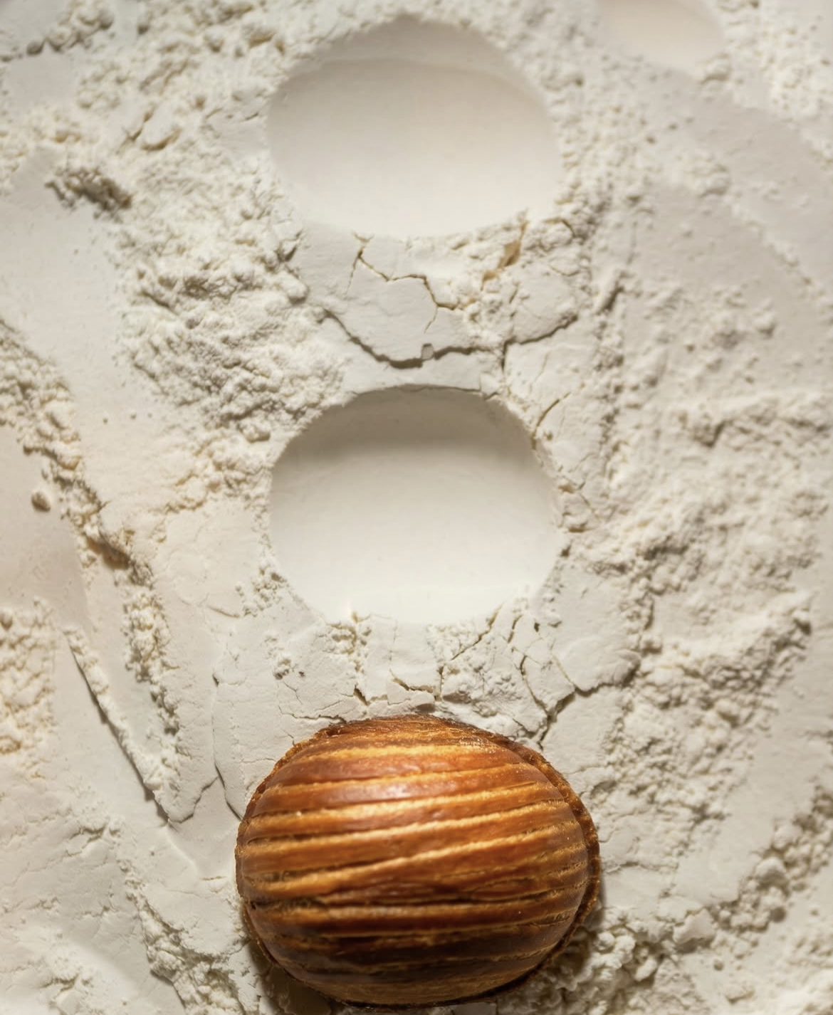 Eggie flour-dusted surface — Social Goods Modern Bakery Central kitchen.