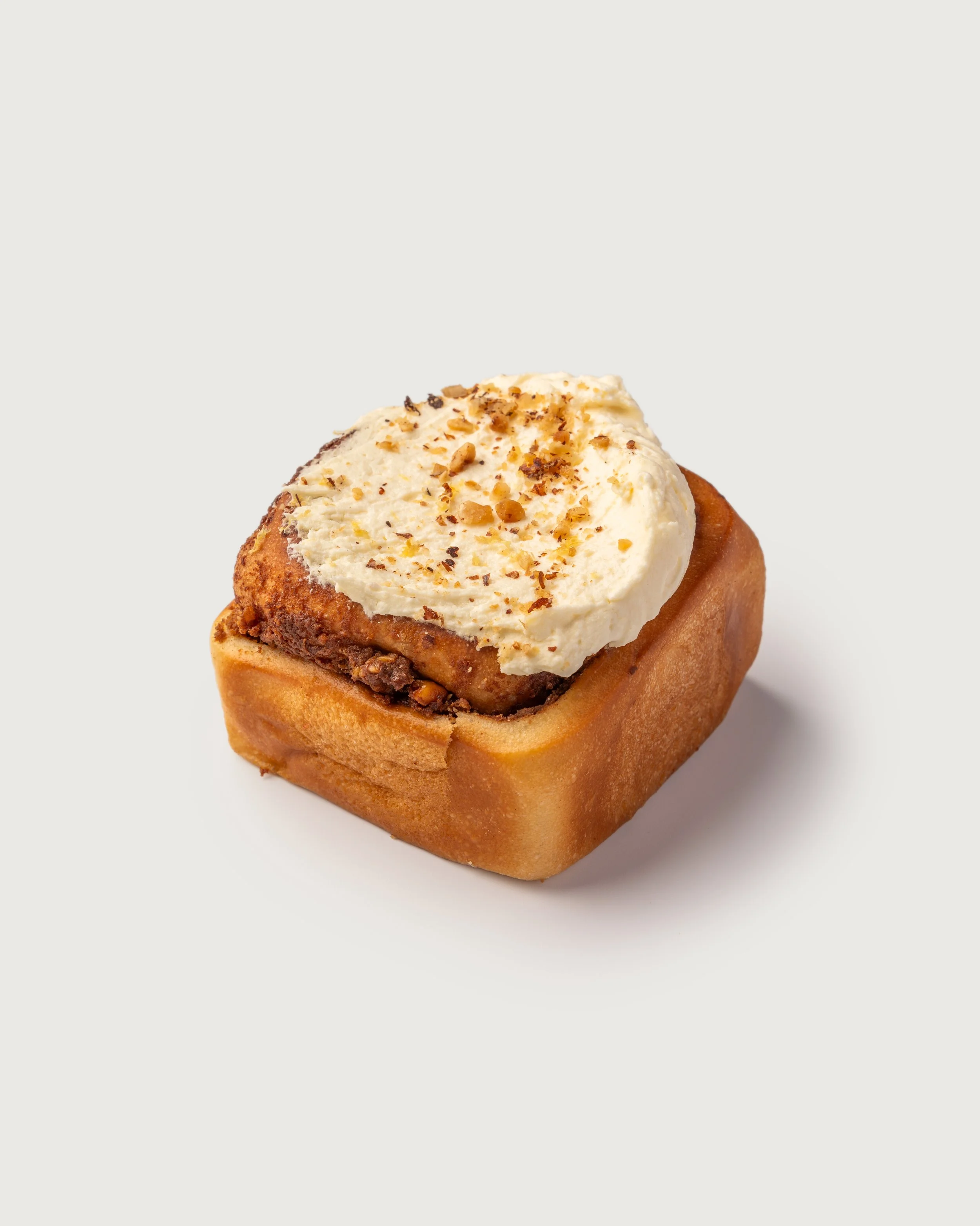 Cinammon Bun pastry  with cream and toasted nuts from Social Goods Modern Bakery, Central Hong Kong.